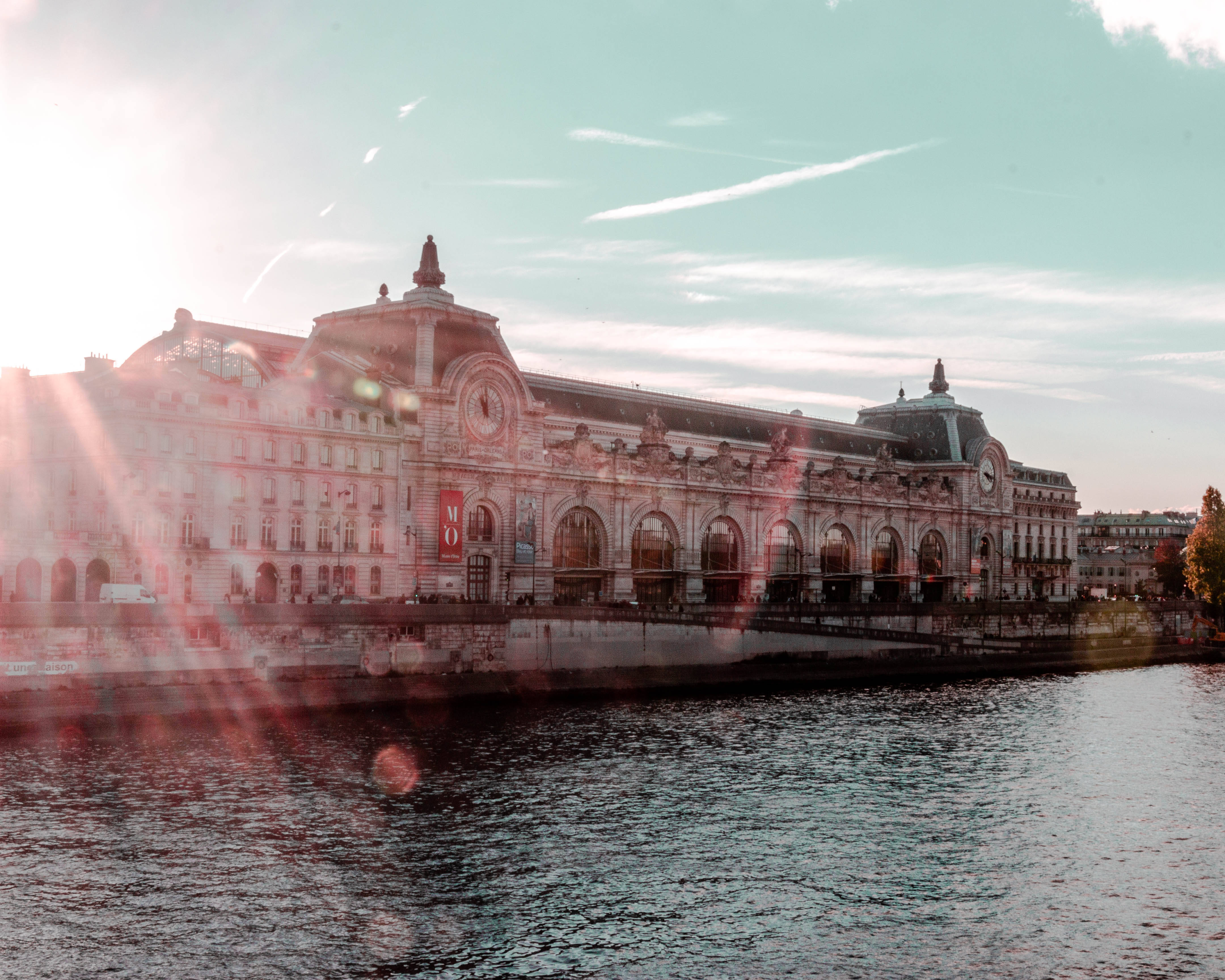 Grand ornate building, arched windows, calm water, 4K Desktop Wallpaper