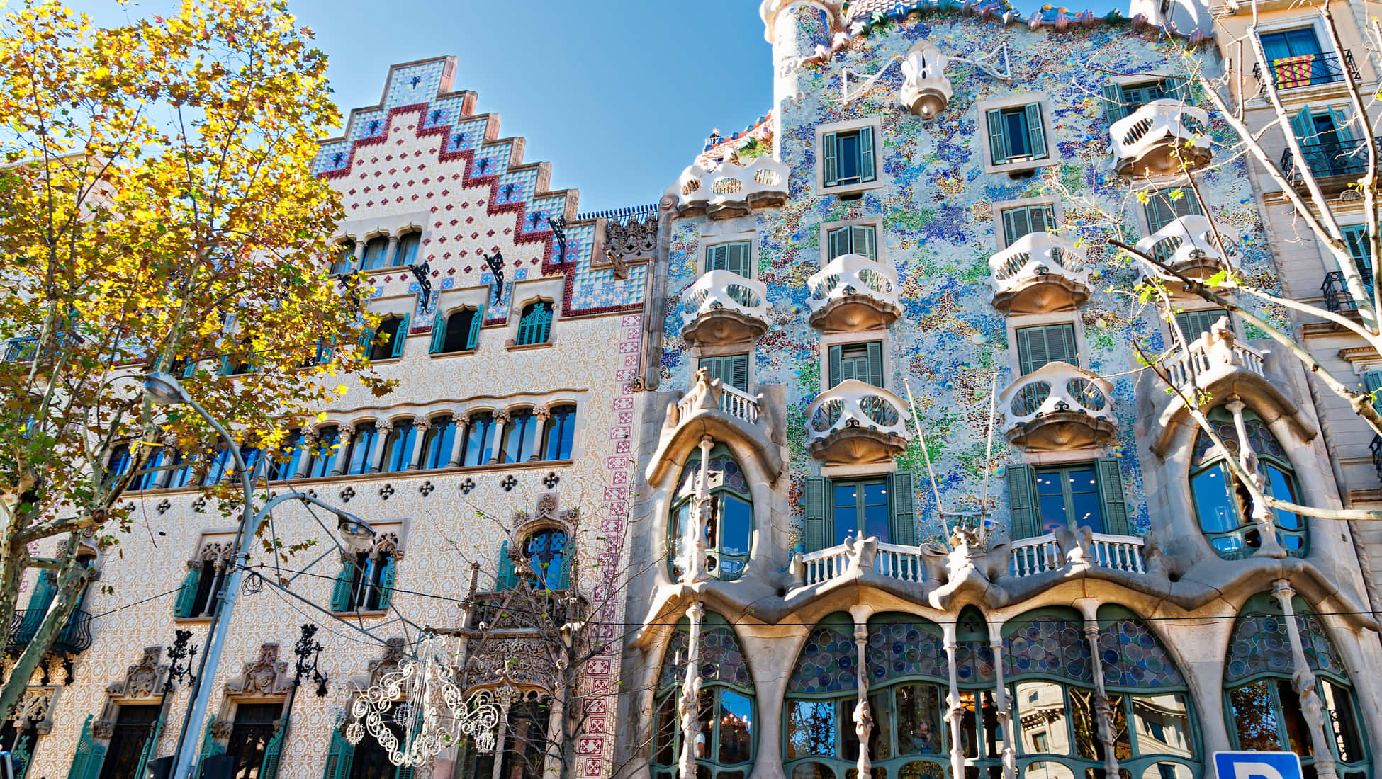 Vibrant mosaic-covered buildings, ornate balconies, blue-green windows, Full HD Desktop Wallpaper