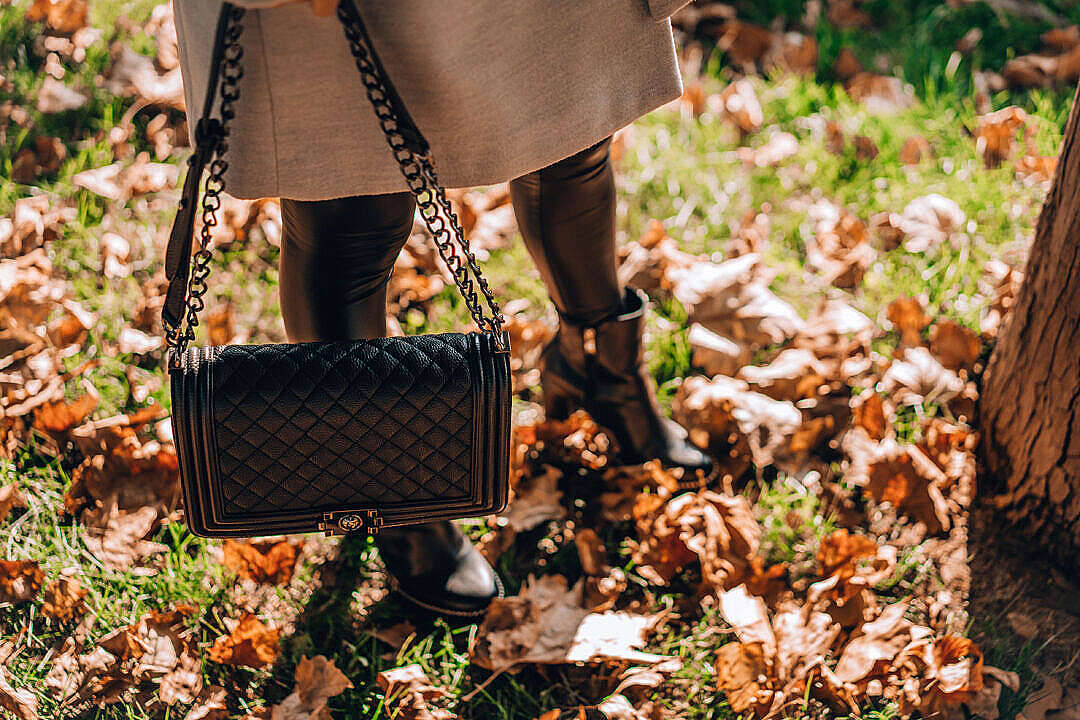 beige coat, black boots, grass covered with fallen autumn leaves, SD Desktop Wallpaper