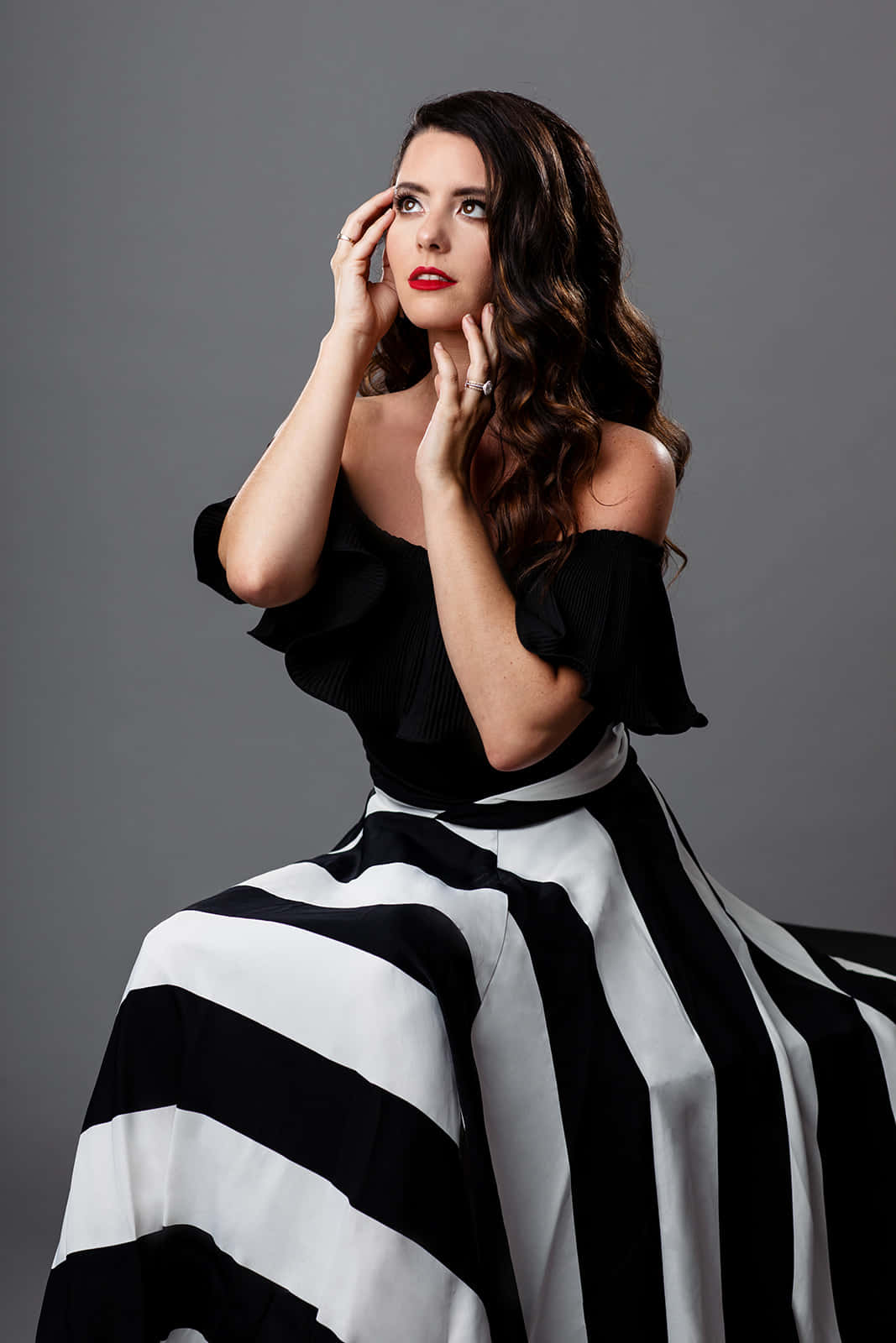 black top, bold black-and-white striped skirt, neutral gray studio backdrop, HD Phone Wallpaper
