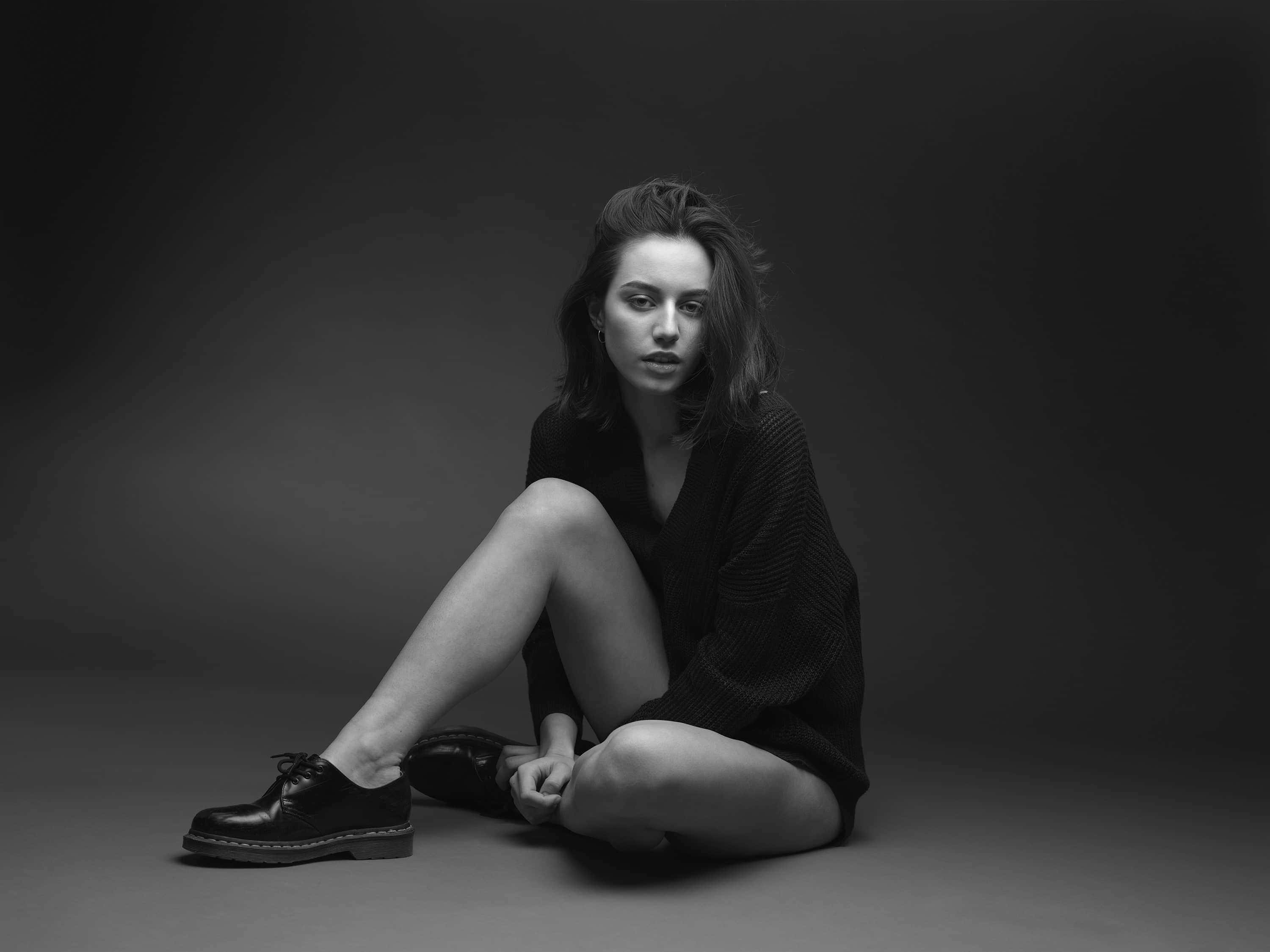 black and white studio portrait, dramatic lighting, woman, 2K Desktop Wallpaper