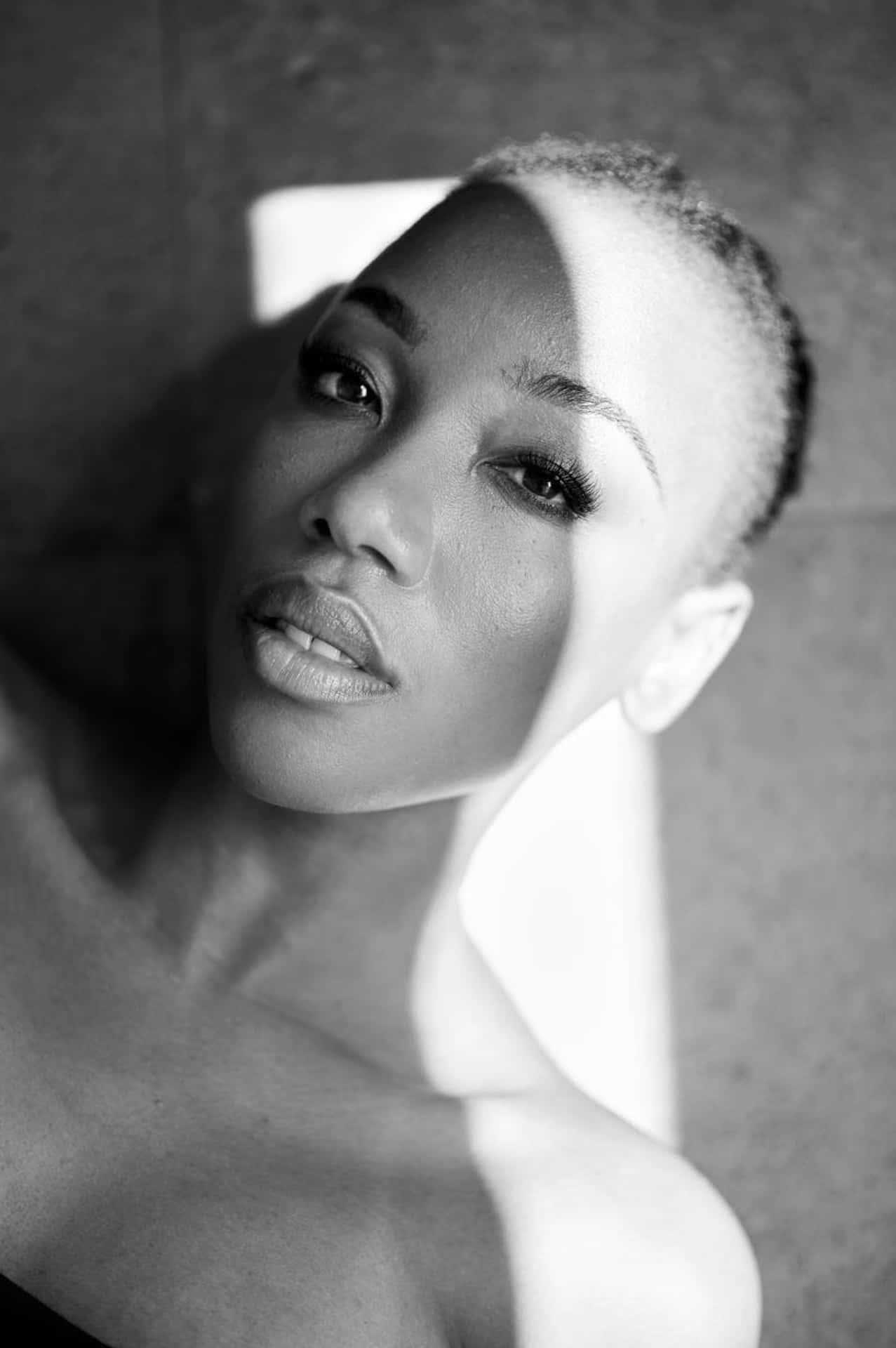 elegant blackand white portrait, woman with short hair, gazing directly at the camera, Full HD Phone Wallpaper