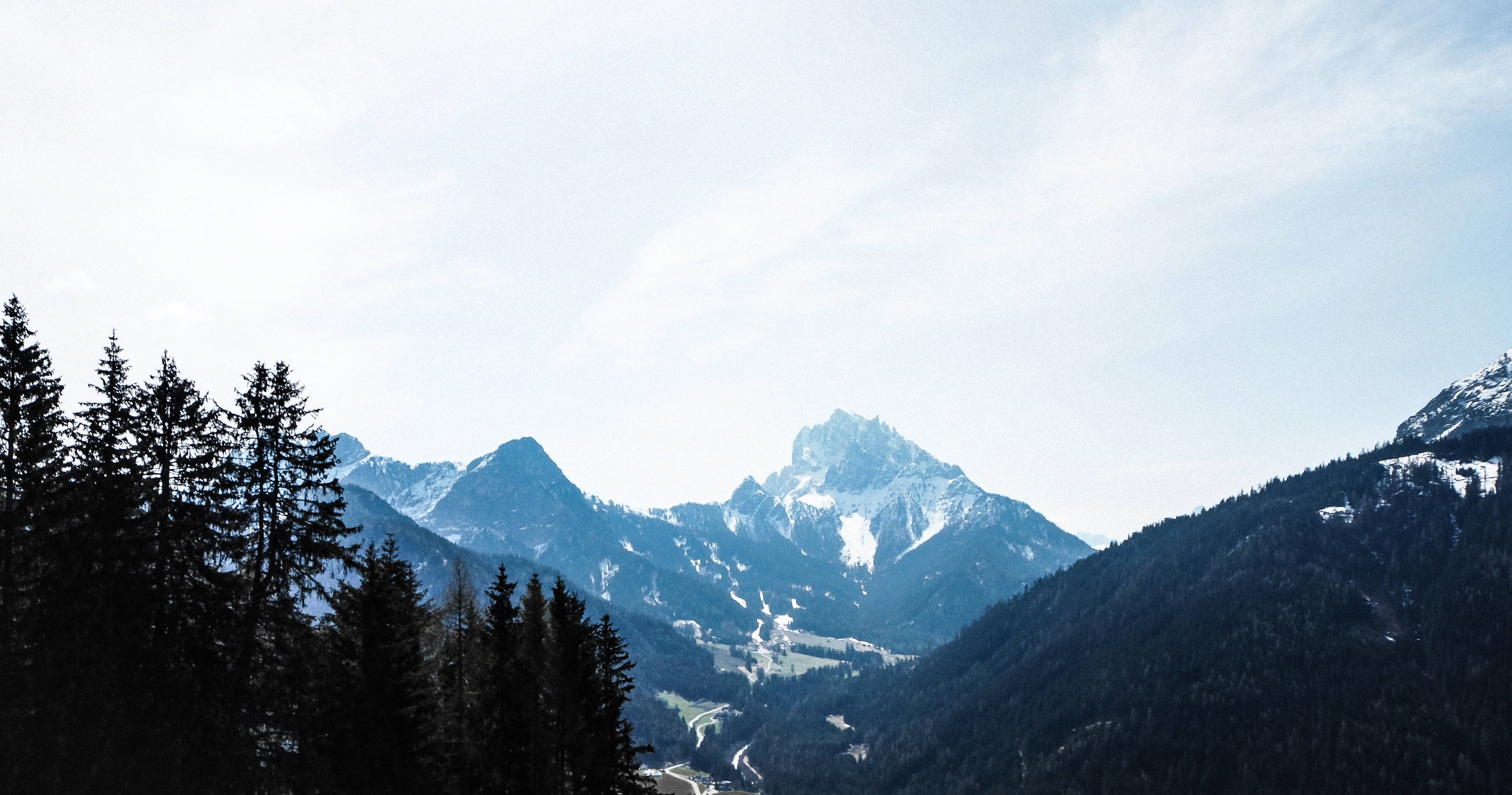 mountains, snow-capped mountain peak, dense evergreen forests, 4K Desktop Wallpaper
