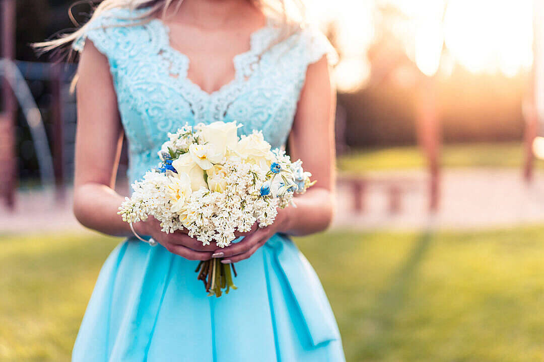 light blue lace dress, white and blue floral bouquet, sunlit outdoor backdrop, SD Desktop Wallpaper