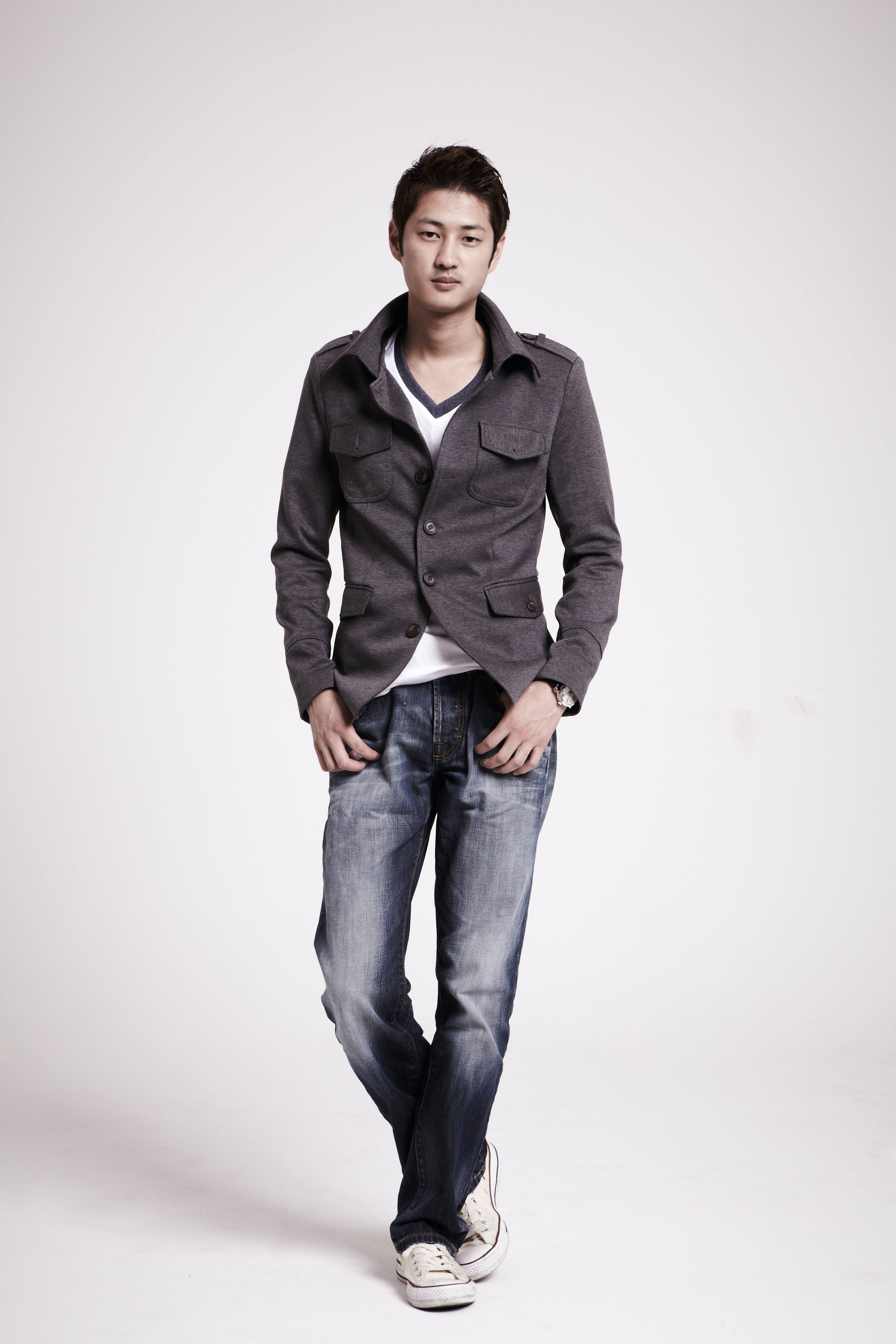 gray jacket, jeans, plain white studio background, 4K Phone Wallpaper