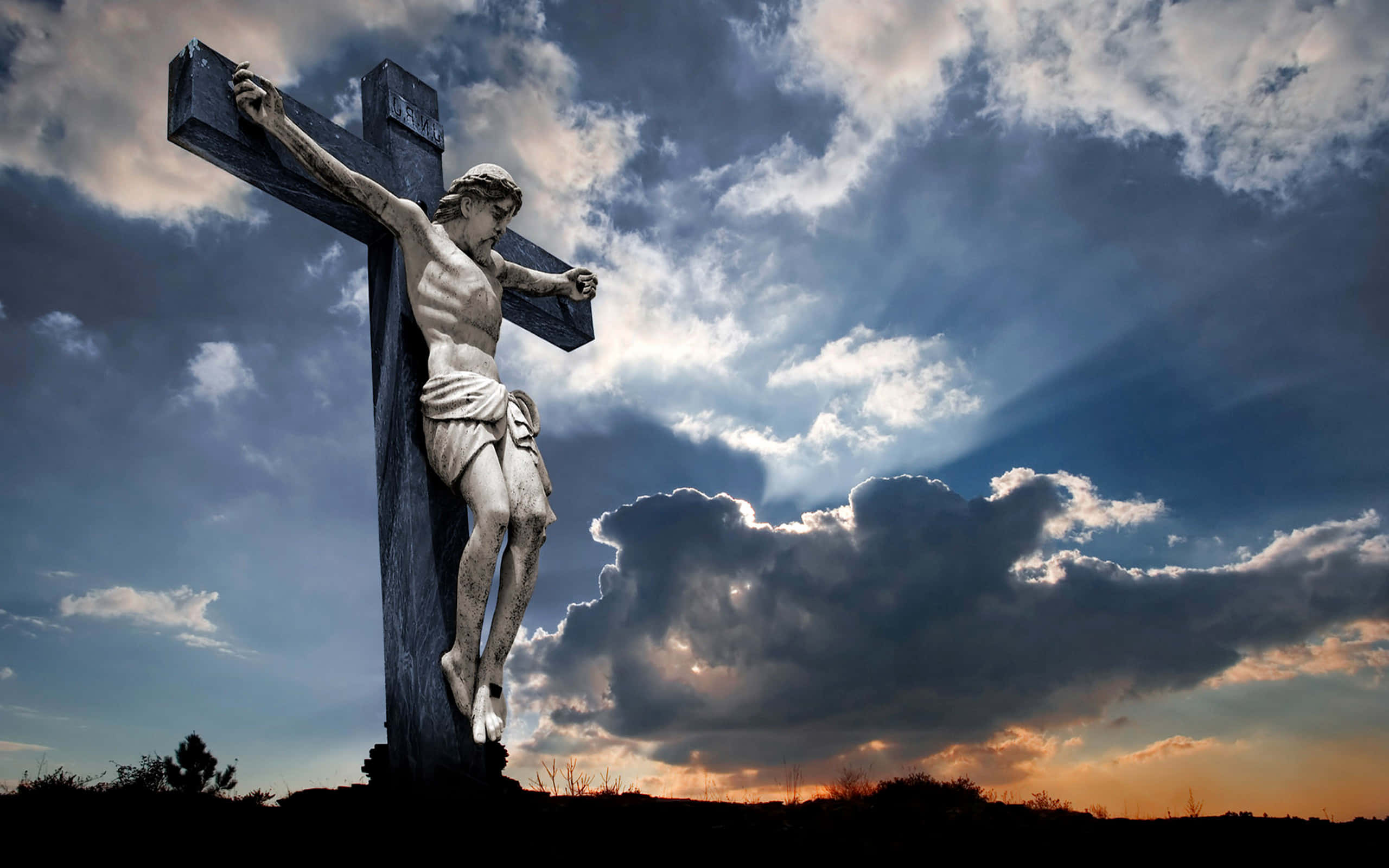 crucifixion statue, twilight sky, billowing clouds, 2K Desktop Wallpaper
