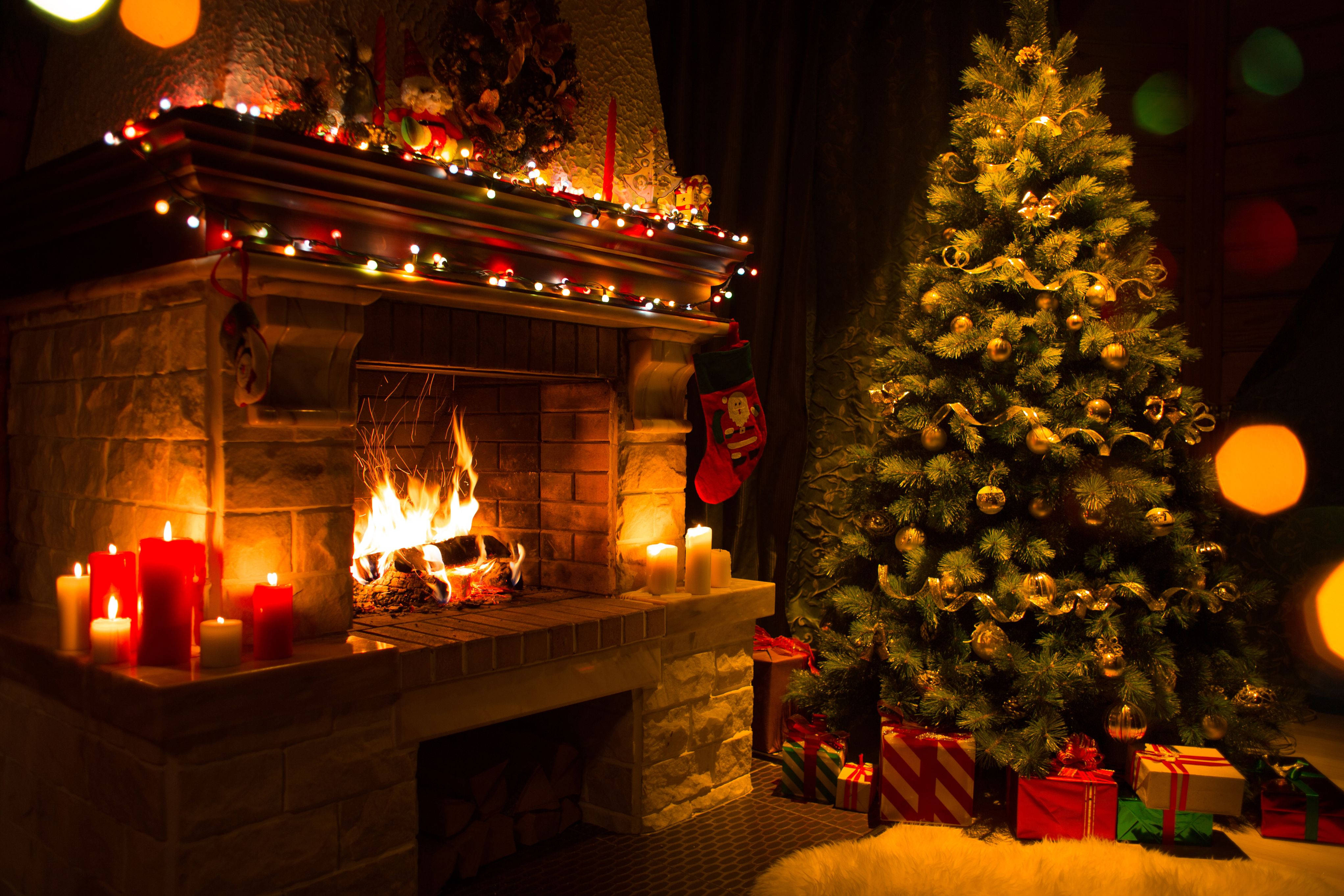 cozy christmas scene, lit stone fireplace, decorated tree, 4K Desktop Wallpaper