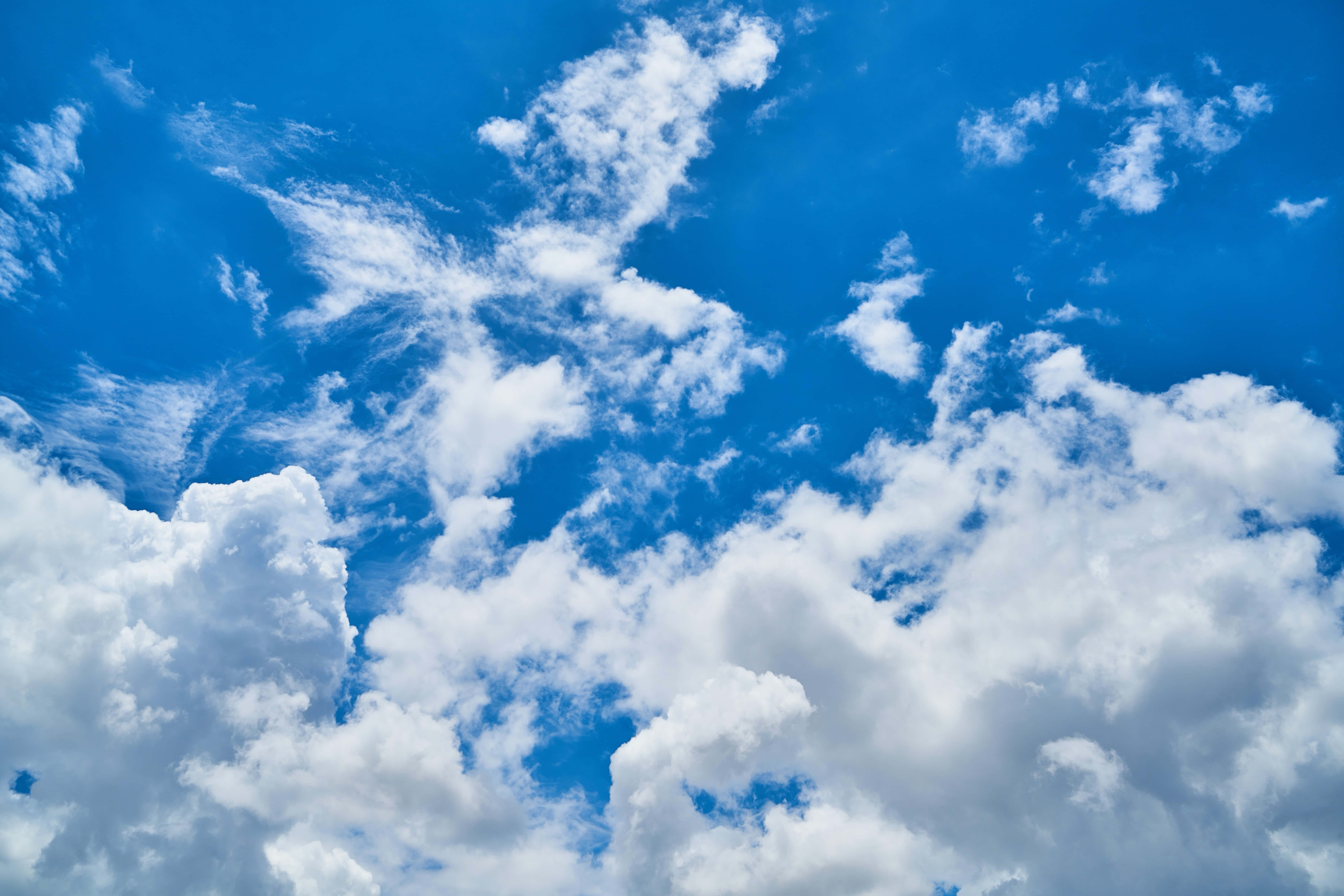 breathtaking beauty of clouds, vibrant blue sky, fluffy white clouds, 8K Desktop Wallpaper