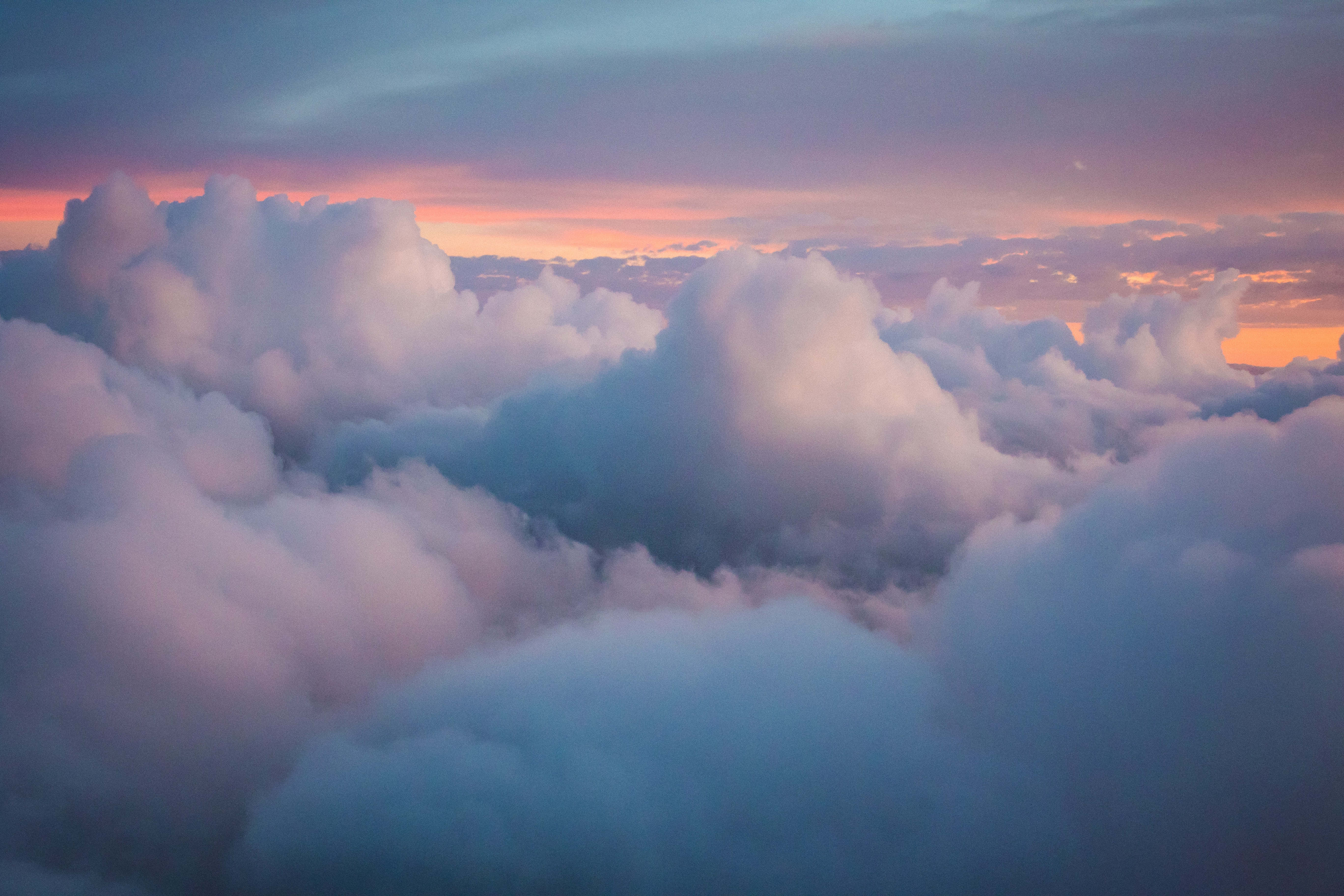fluffy clouds, bright blue sky, soft pink and blue twilight hues, 5K Desktop Wallpaper