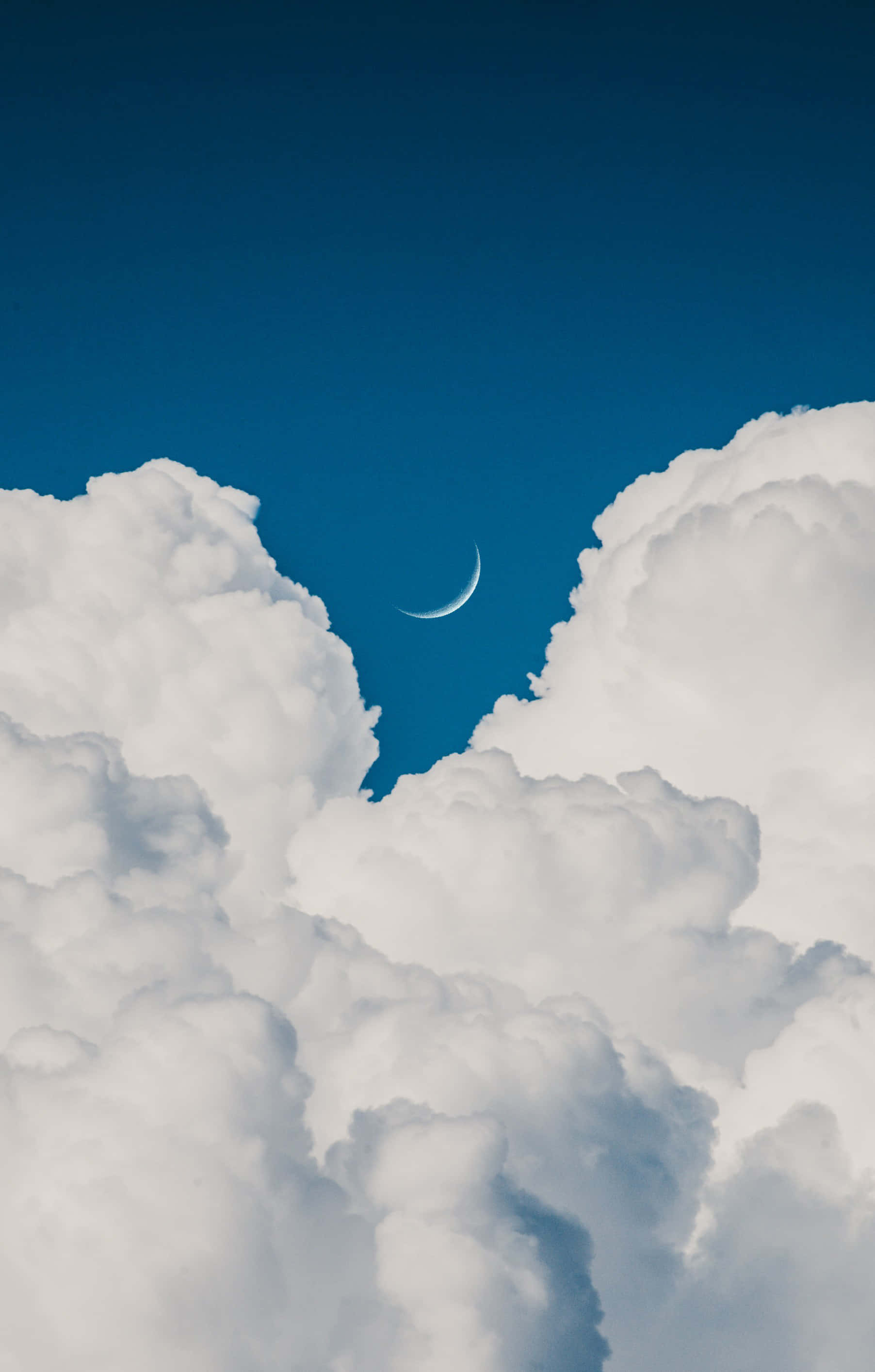 crescent moon, towering white clouds, deep blue sky, 2K Phone Wallpaper