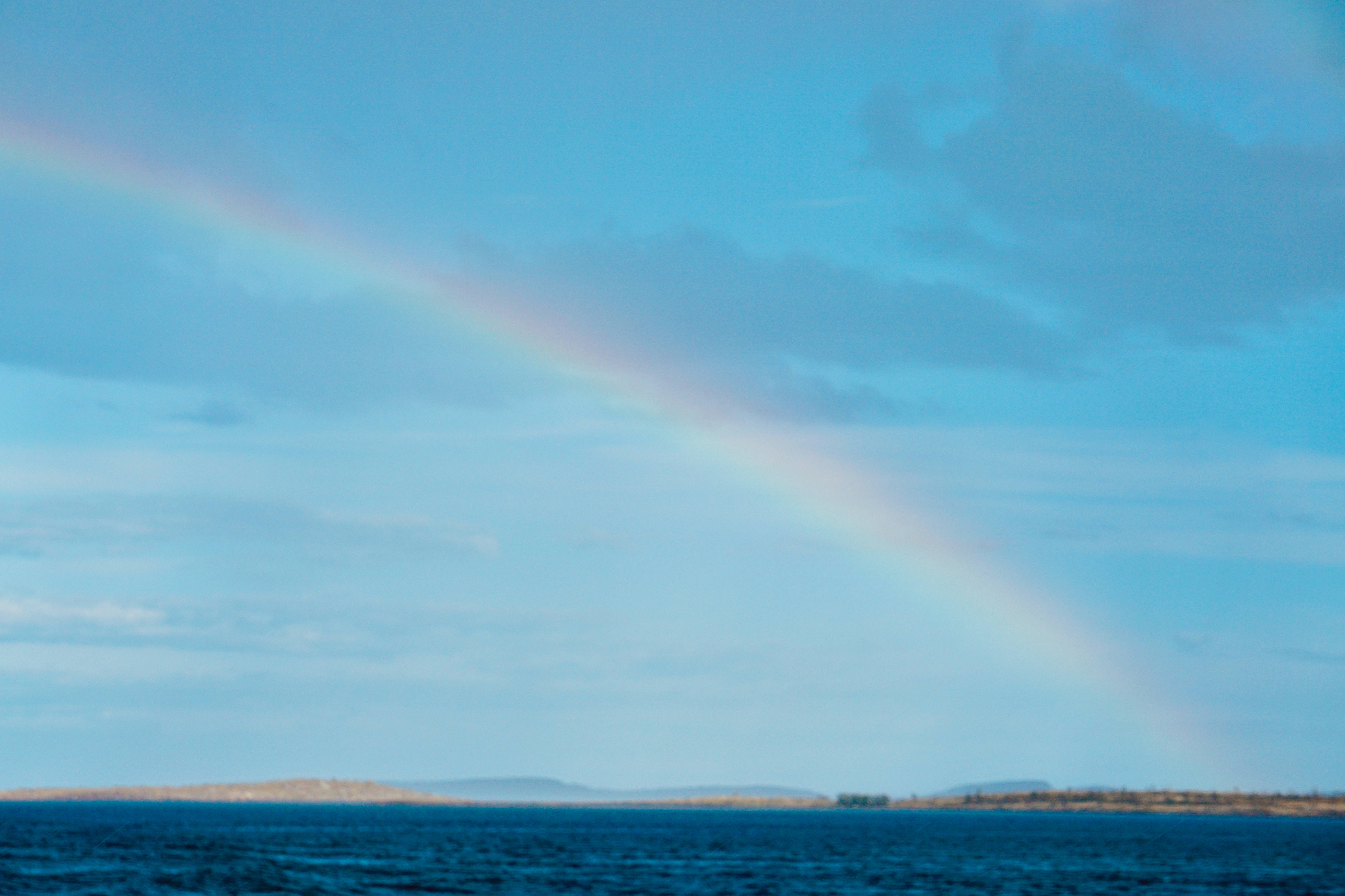 rainbow, blue sea, distant land, 5K Desktop Wallpaper