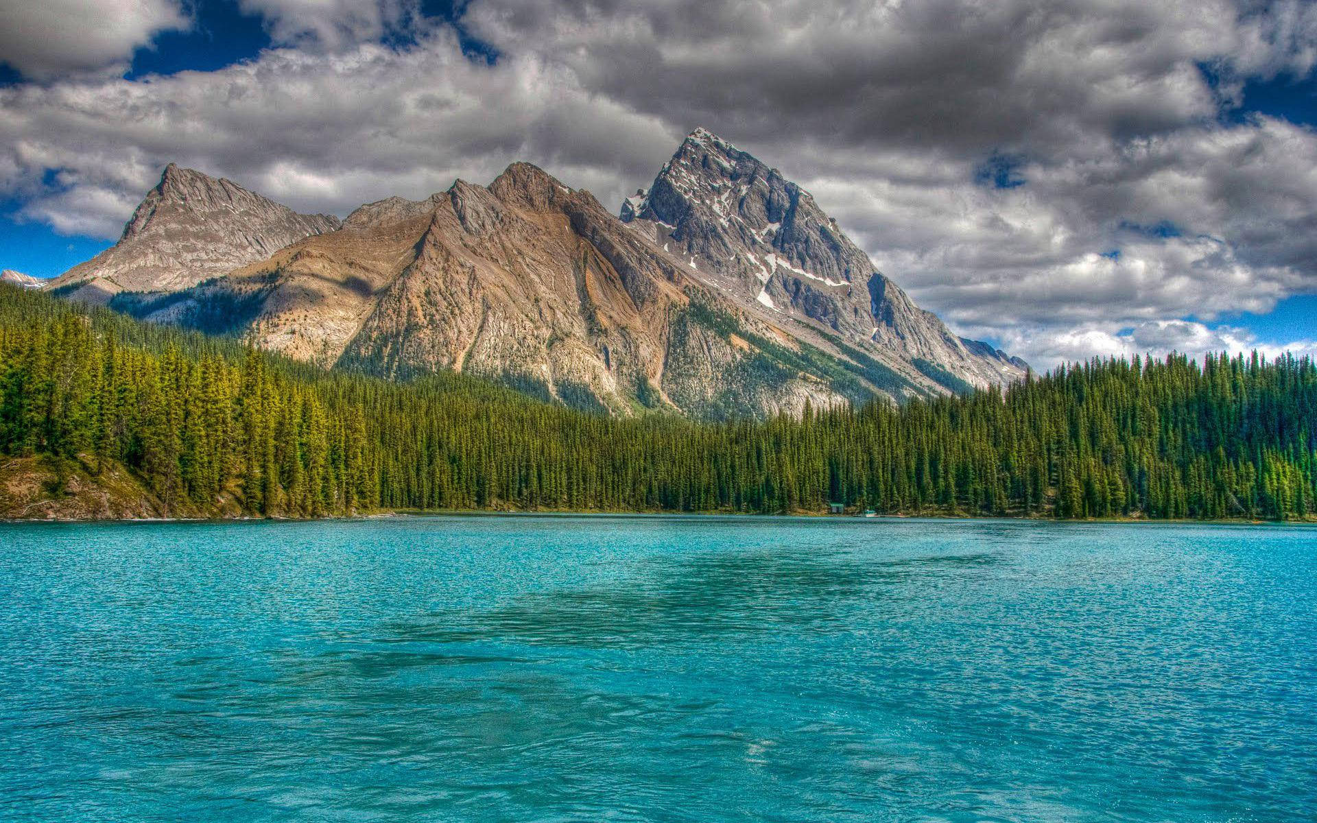 vibrant turquoise lake, dramatic rocky mountains, partly cloudy sky, Full HD Desktop Wallpaper