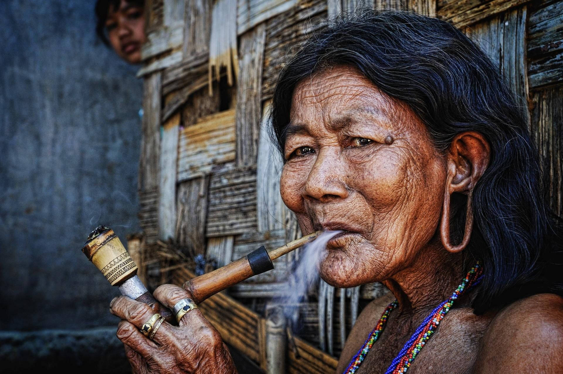 beautiful older woman, bamboo pipe, weathered wooden hut, Full HD Desktop Wallpaper