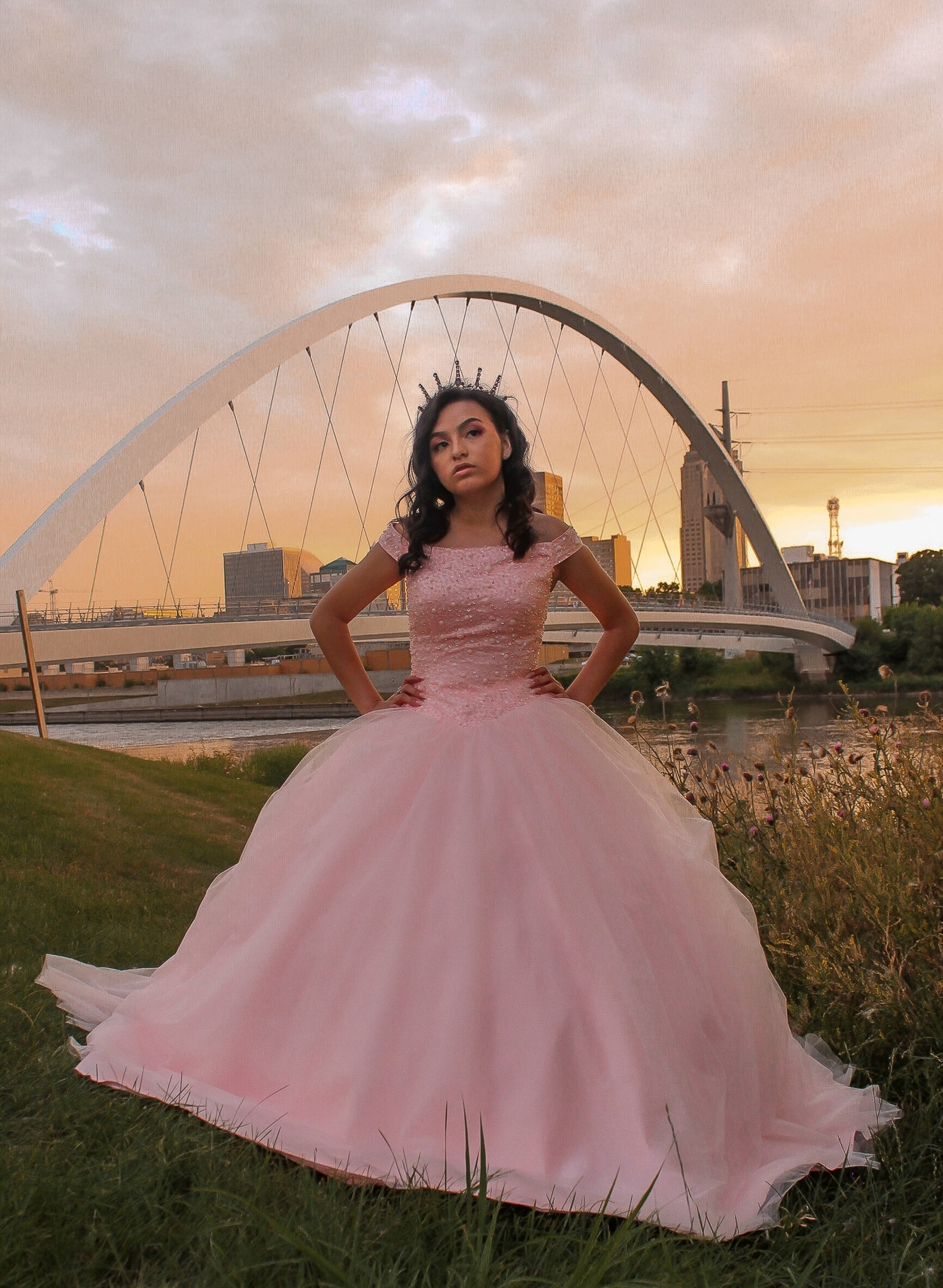 pink quinceanera gown, modern arched bridge, sunset, 2K Phone Wallpaper