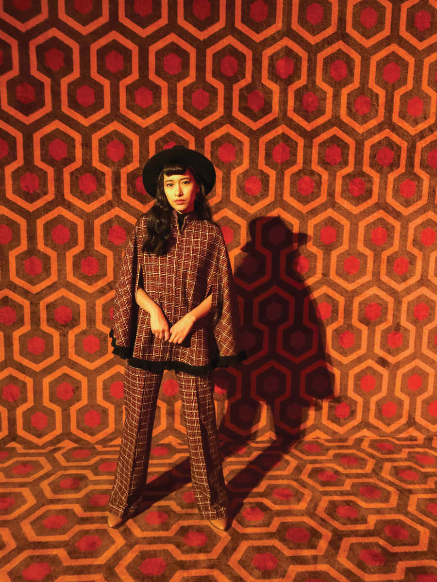 checkered suit, black hat, hexagonal red and orange patterned wall, SD Phone Wallpaper