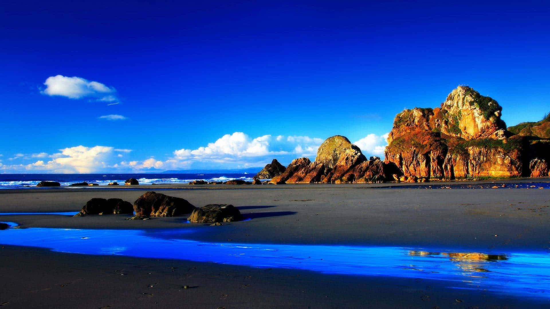 vibrant blue sky, ocean, dramatic rocky cliffs, Full HD Desktop Wallpaper