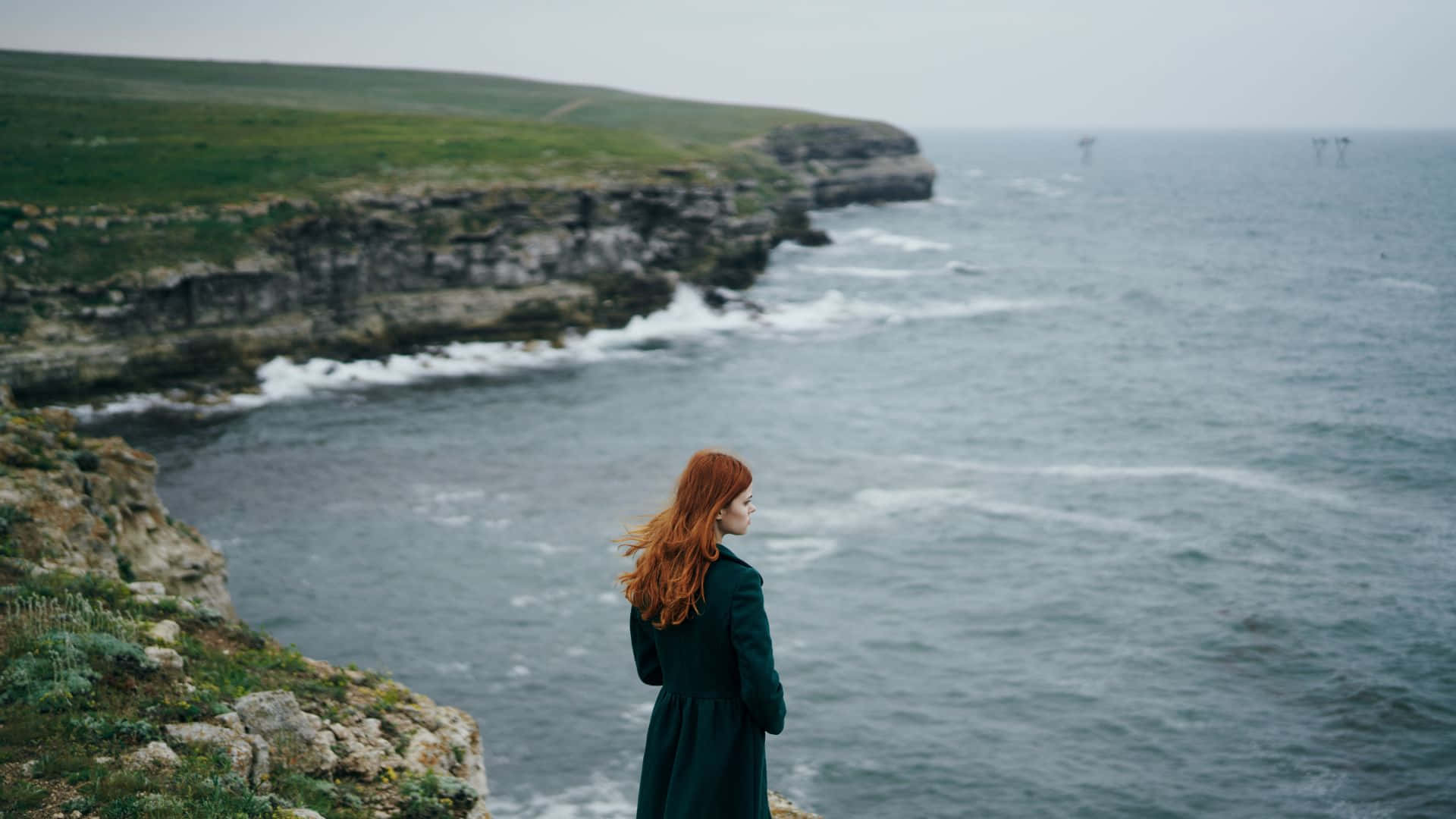 red hair, dark coat, rugged cliff, Full HD Desktop Wallpaper