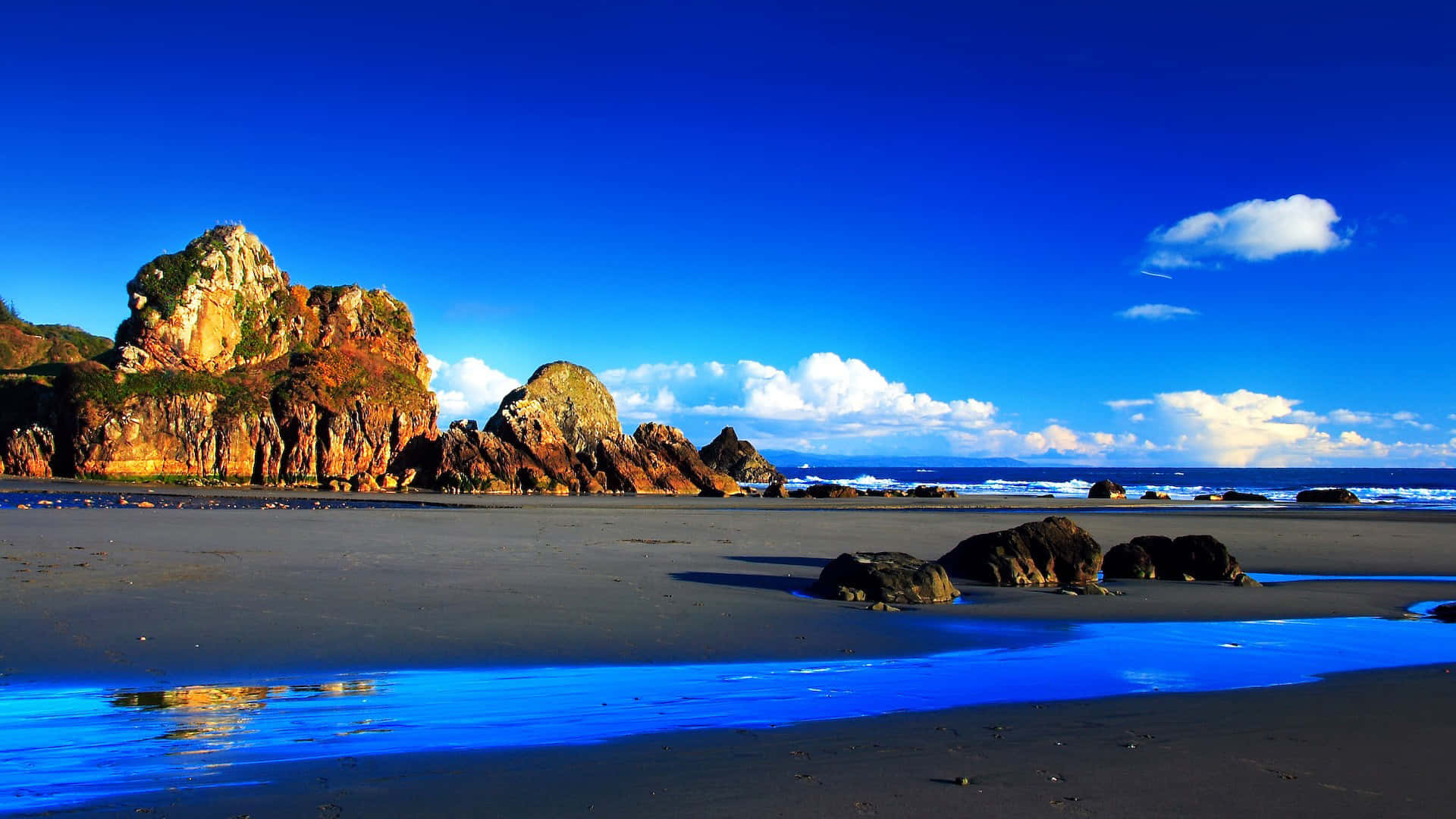 vibrant blue sky, ocean, rugged golden cliffs, Full HD Desktop Wallpaper