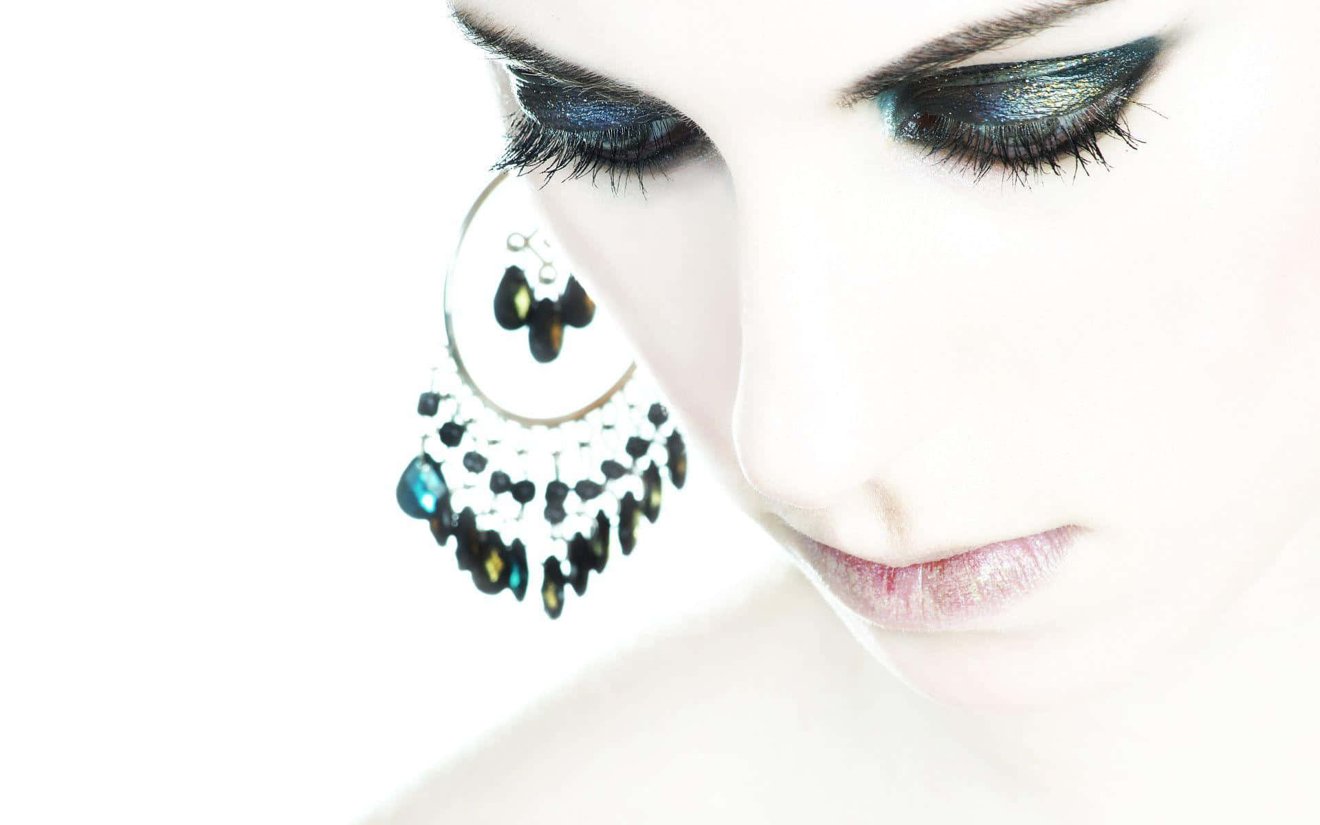 blue-green eye makeup, large dangling earring, stark white background, Full HD Desktop Wallpaper