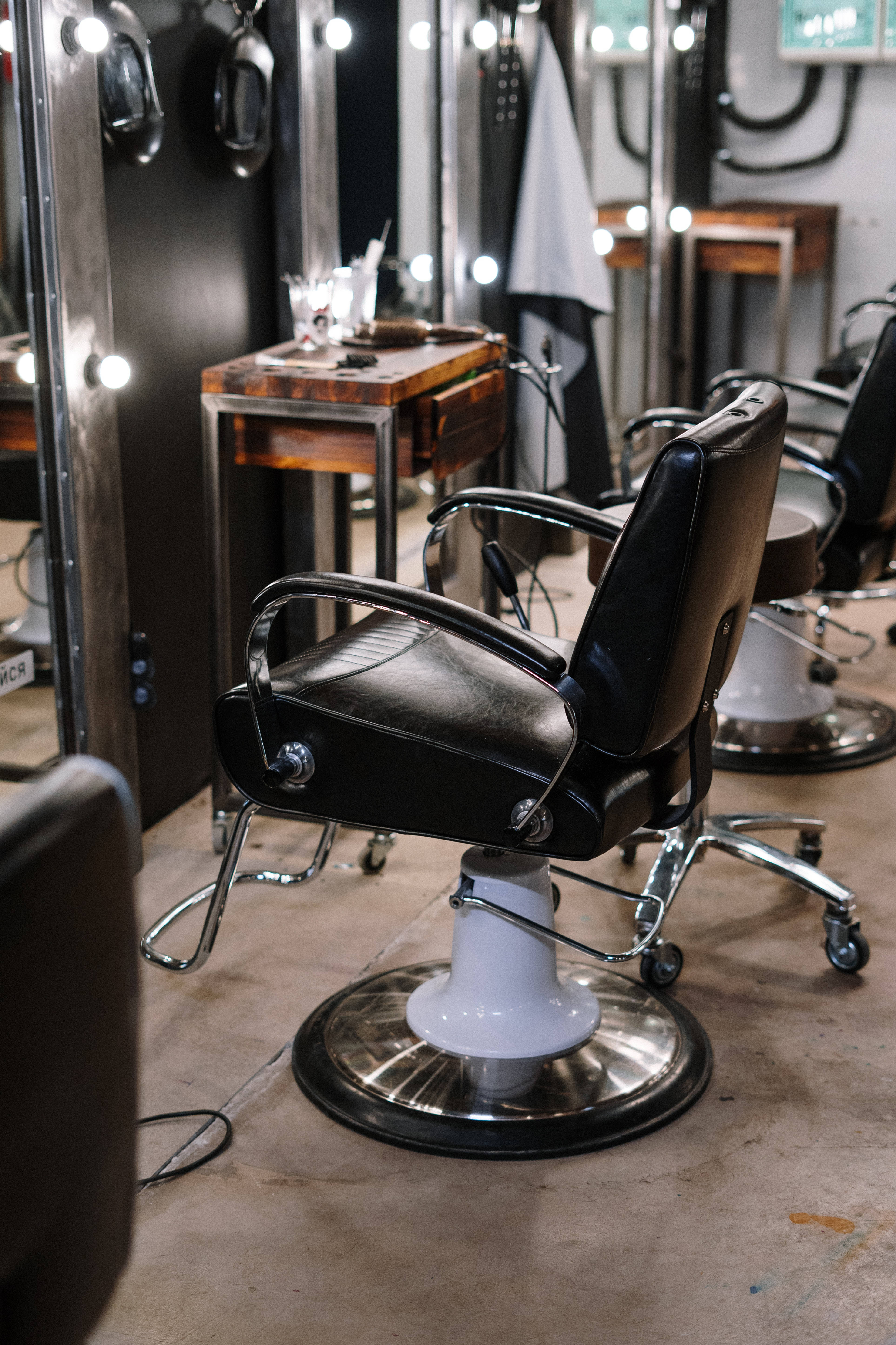 Bauty Salon Swivelling Chair, vintage black barber chair, chrome legs, 5K Phone Wallpaper