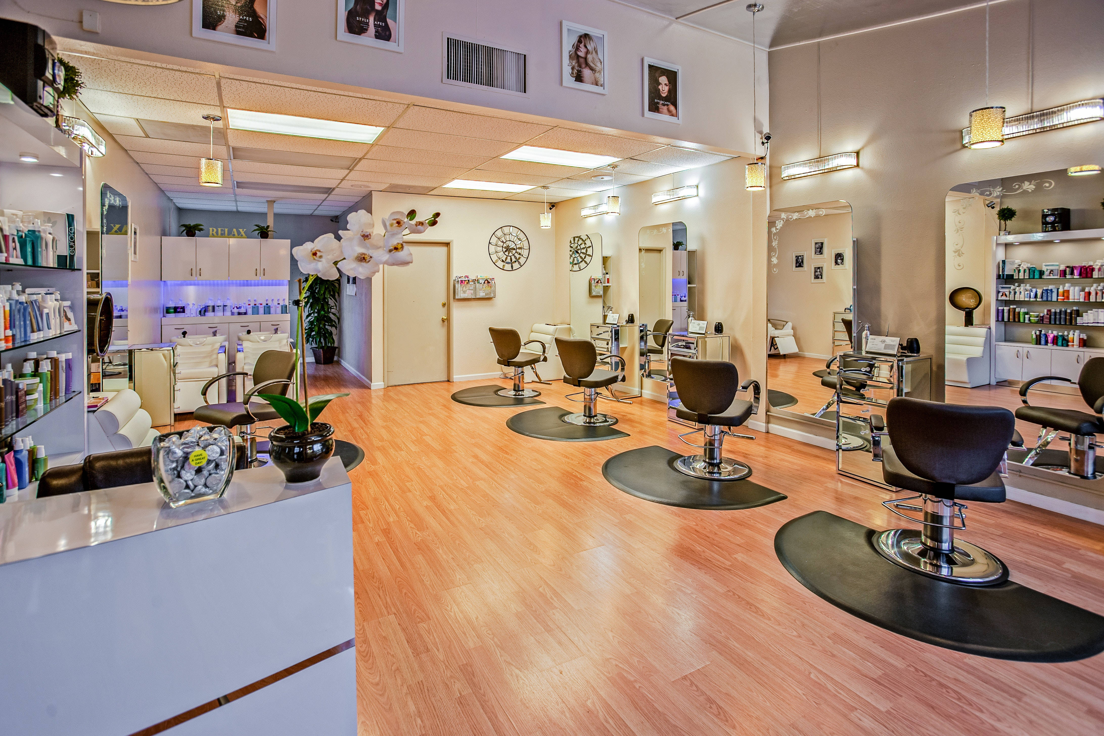 modern hair salon, wooden floors, black styling chairs, 4K Desktop Wallpaper