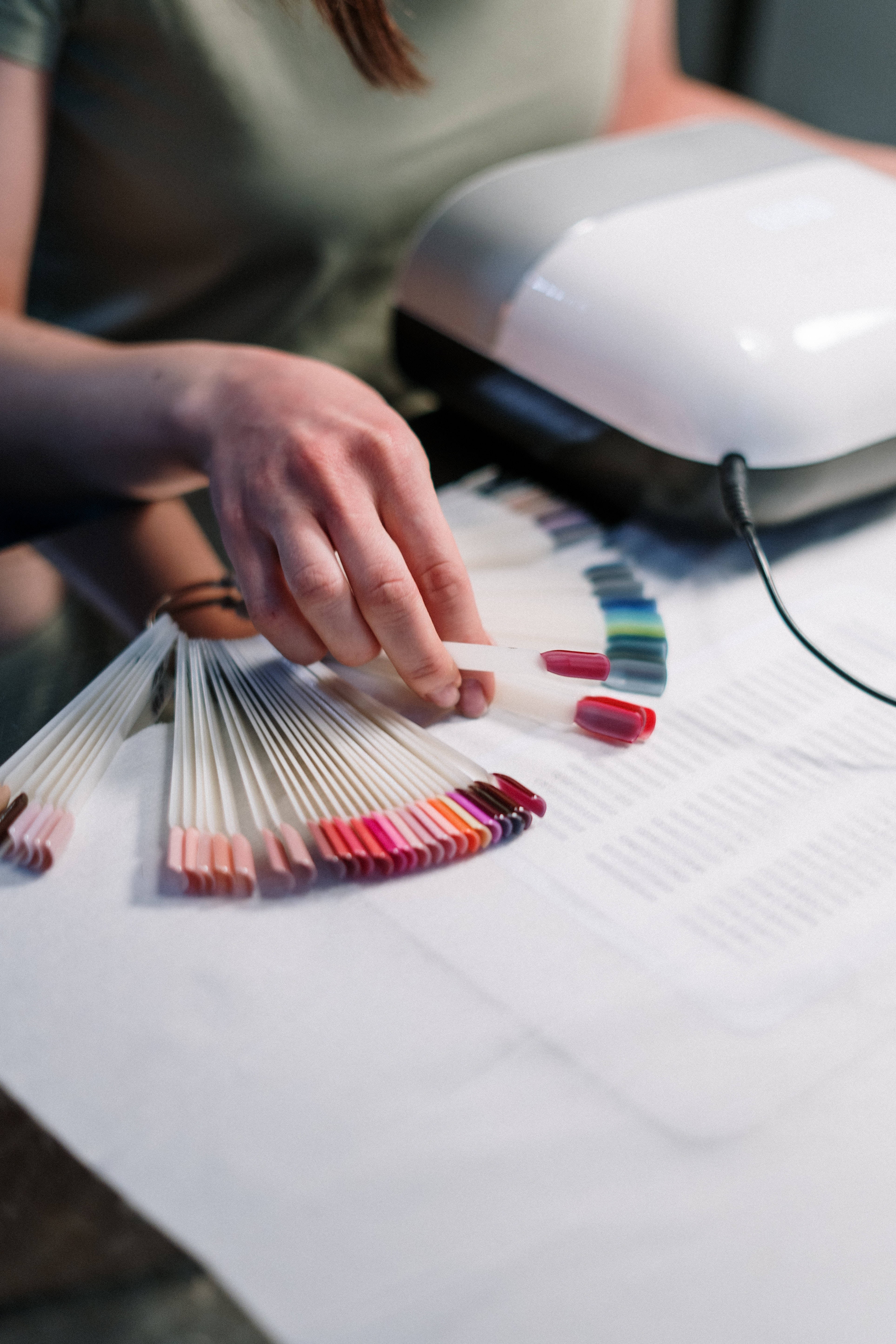 red nail polish swatch, fanned color palette, white nail dryer, 5K Phone Wallpaper