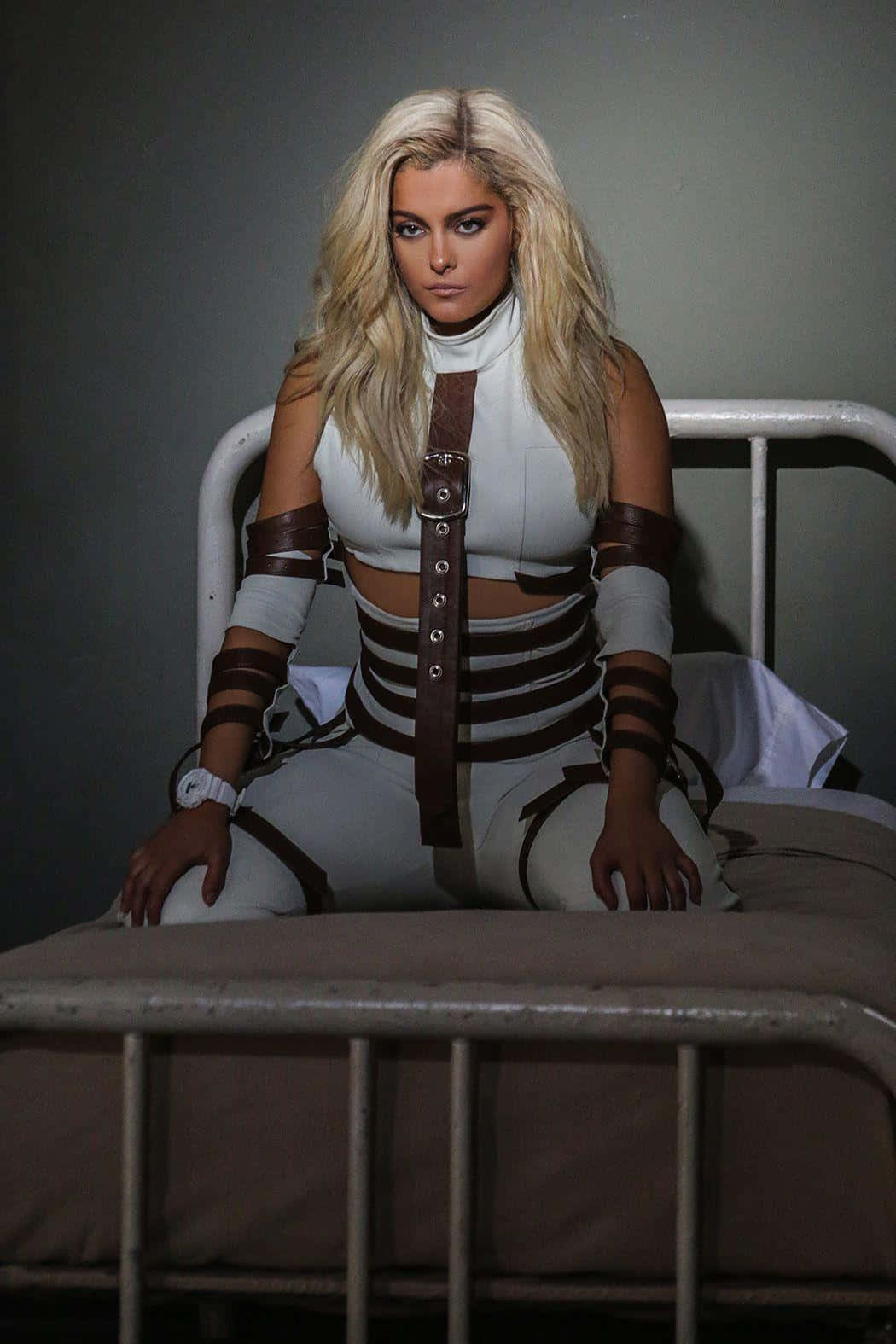 Bebe Rexha, white and brown leather gear, metal bed, HD Phone Wallpaper