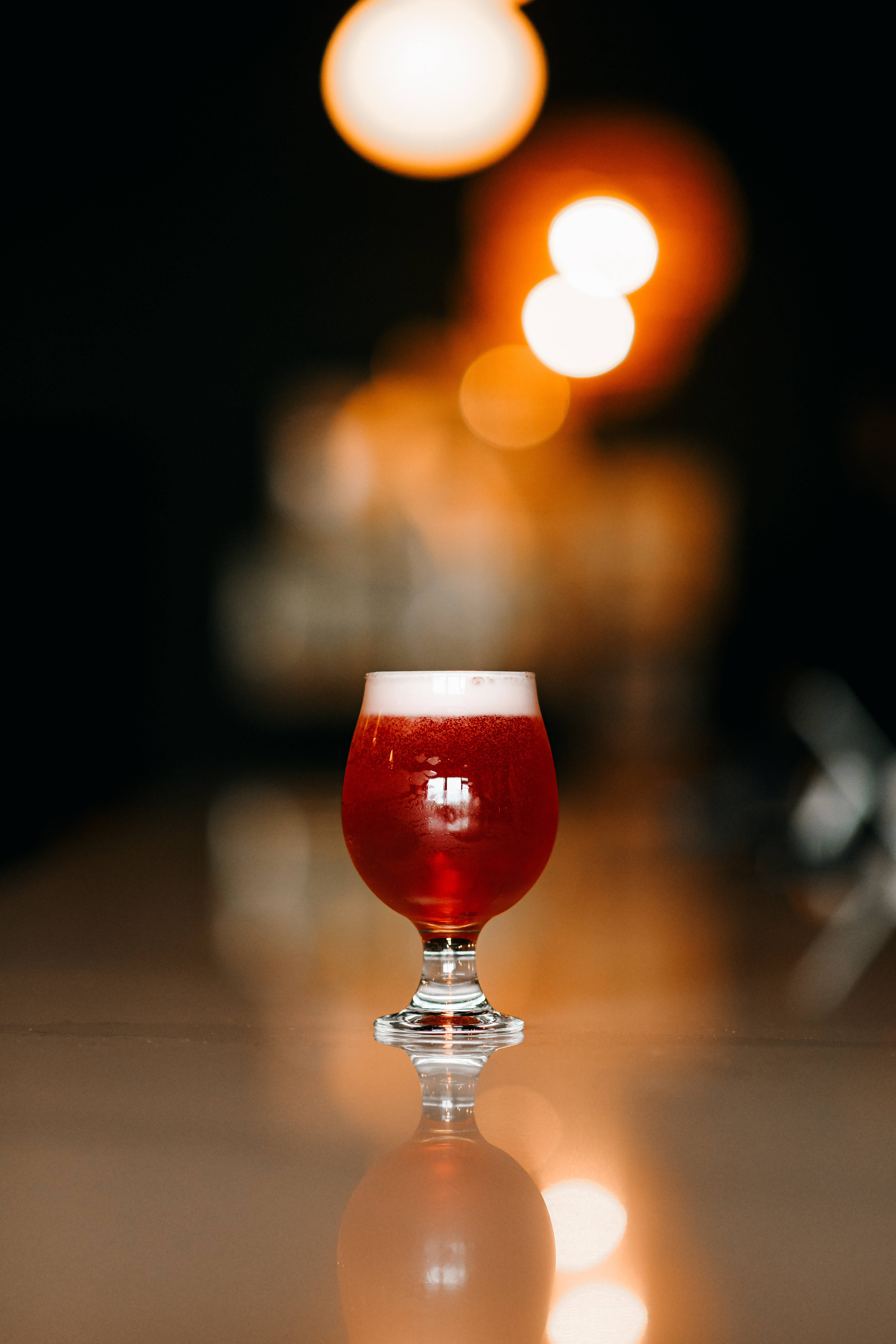 Irish Red Beer, tulip glass, white foam, 5K Phone Wallpaper