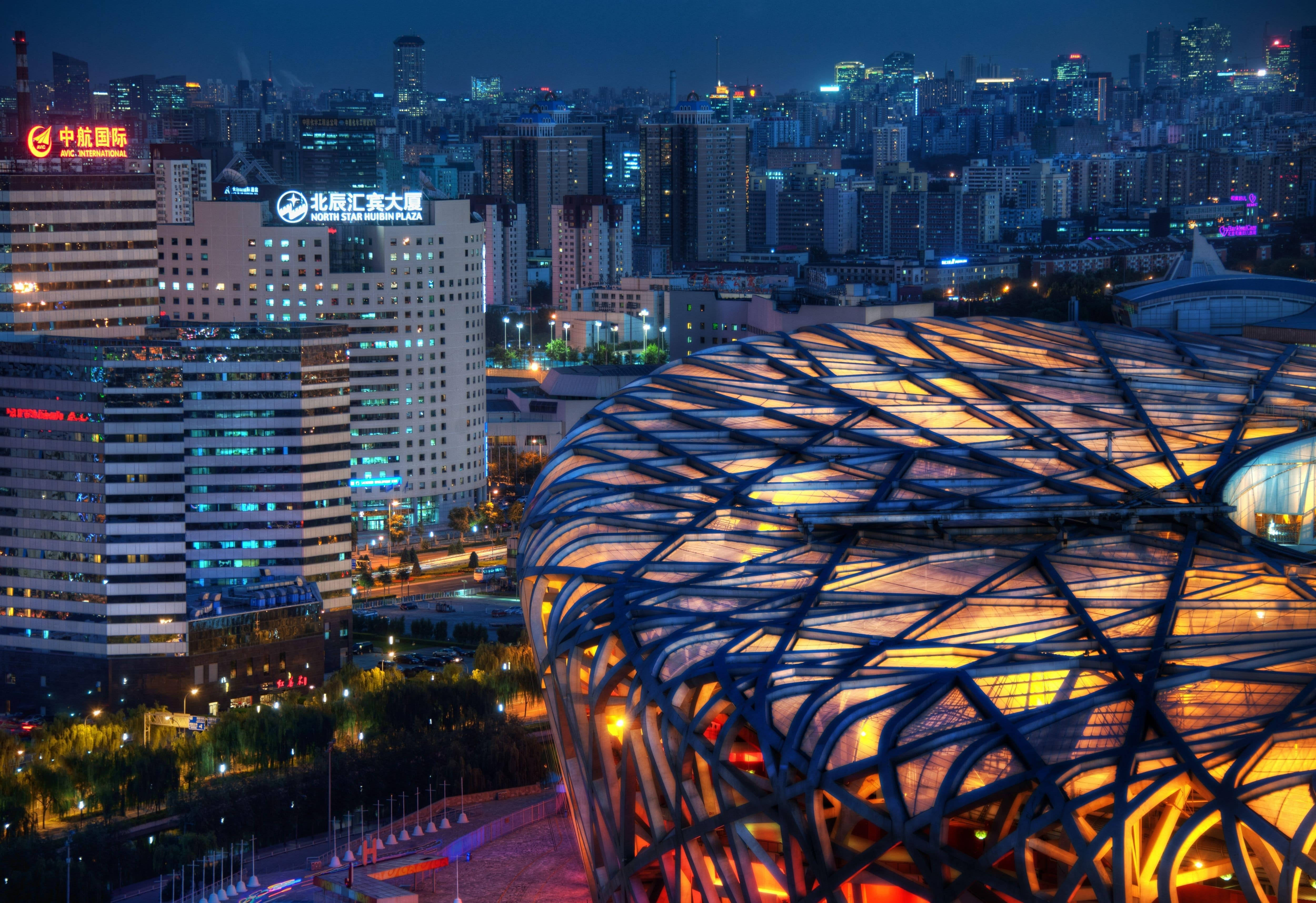 Beijing, futuristic dome-shaped building, glowing warmly, 4K Desktop Wallpaper