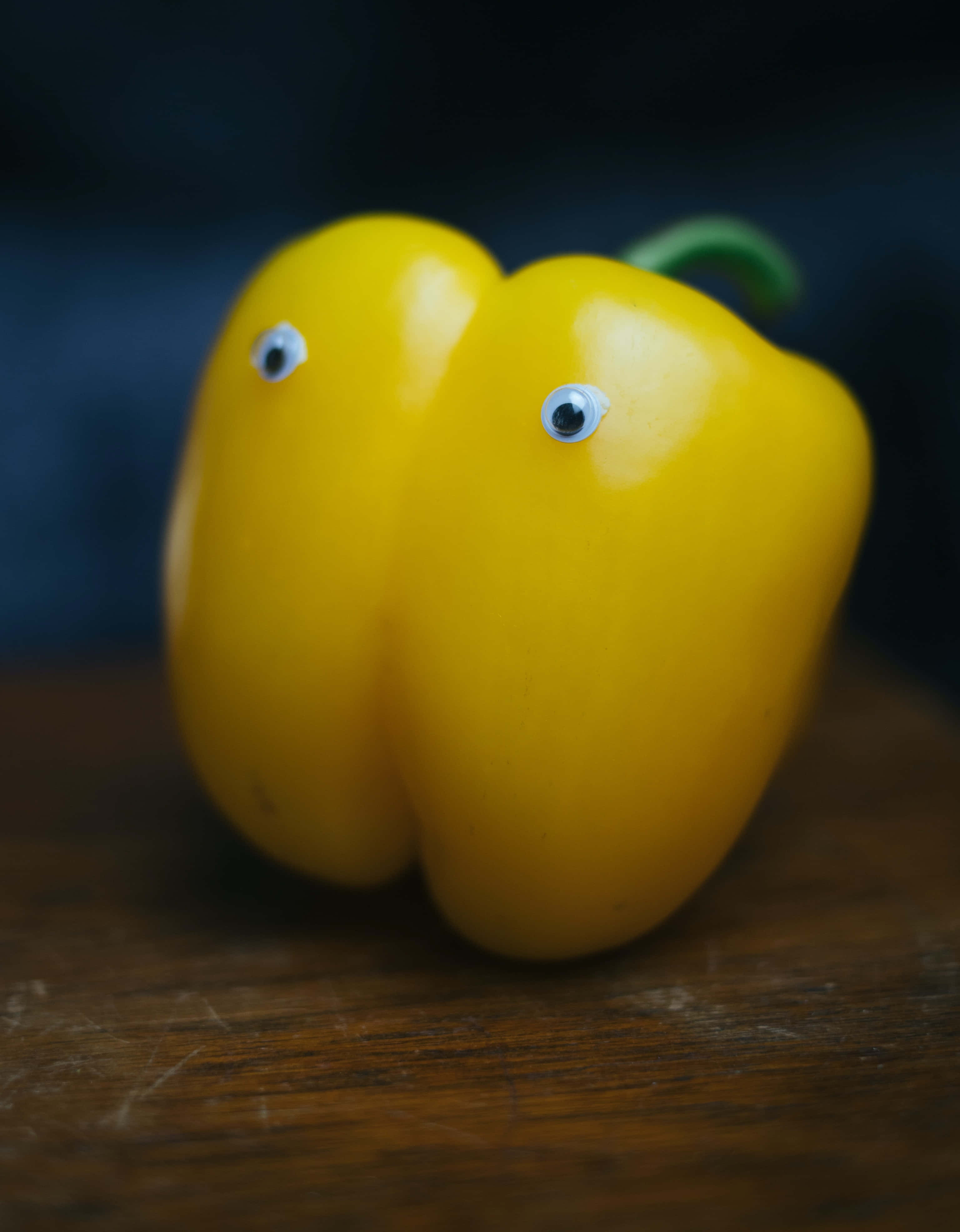 yellow bell pepper, googly eyes, wooden surface, 4K Phone Wallpaper