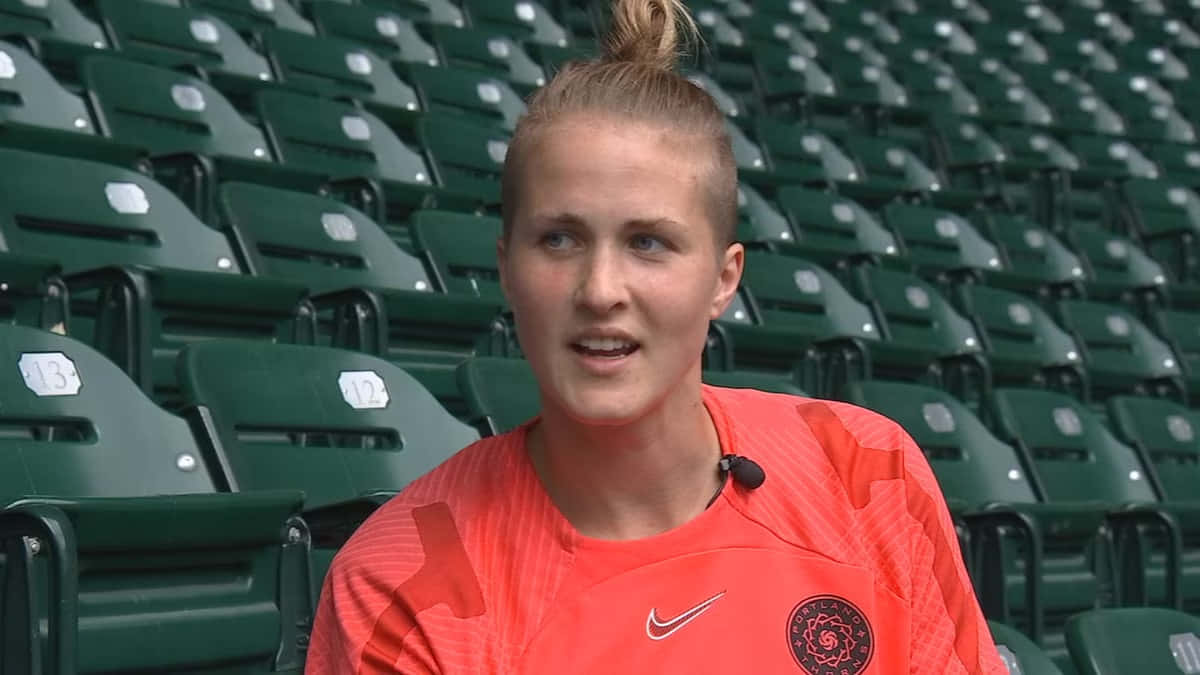 Bella Bixby, orange jersey, green stadium seats, SD Desktop Wallpaper