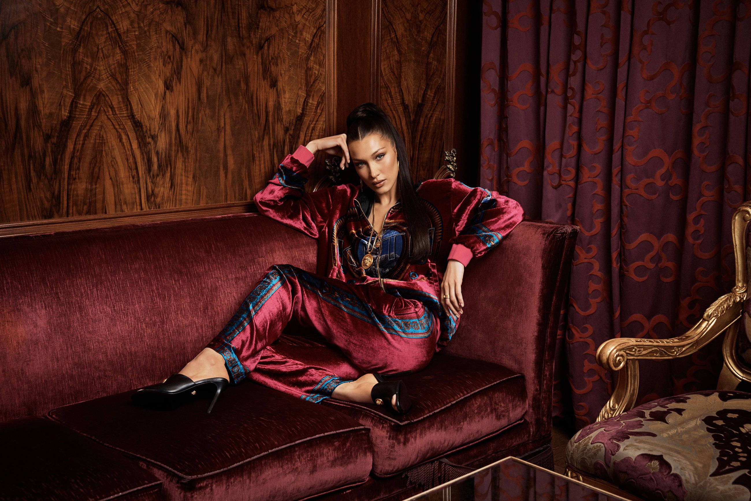Bella Hadid, maroon velvet loungewear set, matching sofa, 2K Desktop Wallpaper