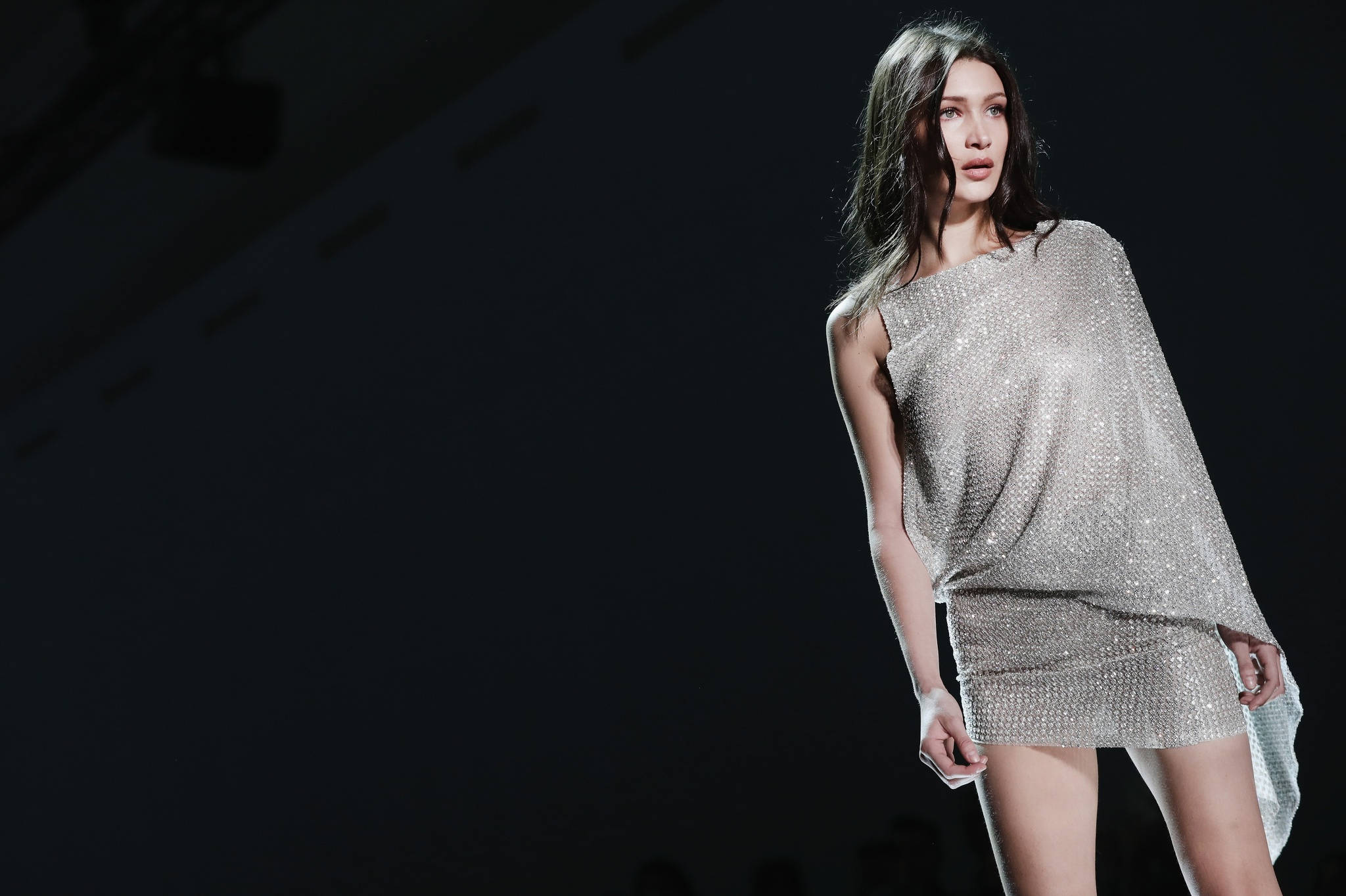 Bella Hadid, shimmering silver sequined dress, dramatic runway lighting, Full HD Desktop Wallpaper
