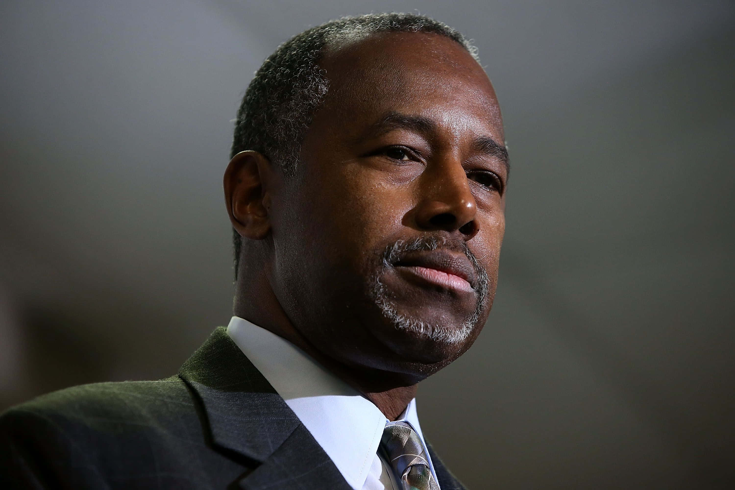 Ben Carson, middle-aged Black man, dark suit, 2K Desktop Wallpaper