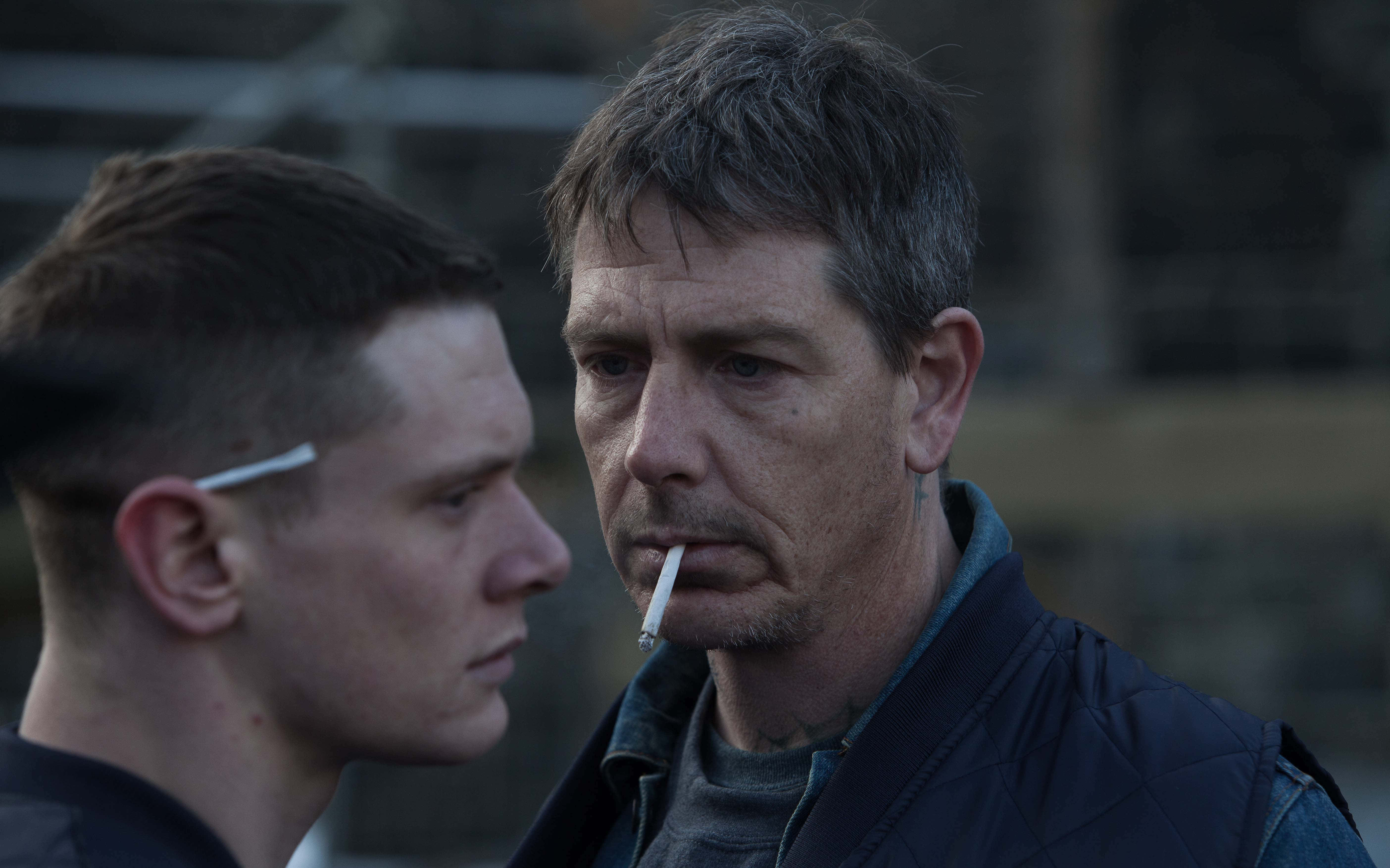 Ben Mendelsohn, tense outdoor confrontation, smokes a cigarette, 5K Desktop Wallpaper