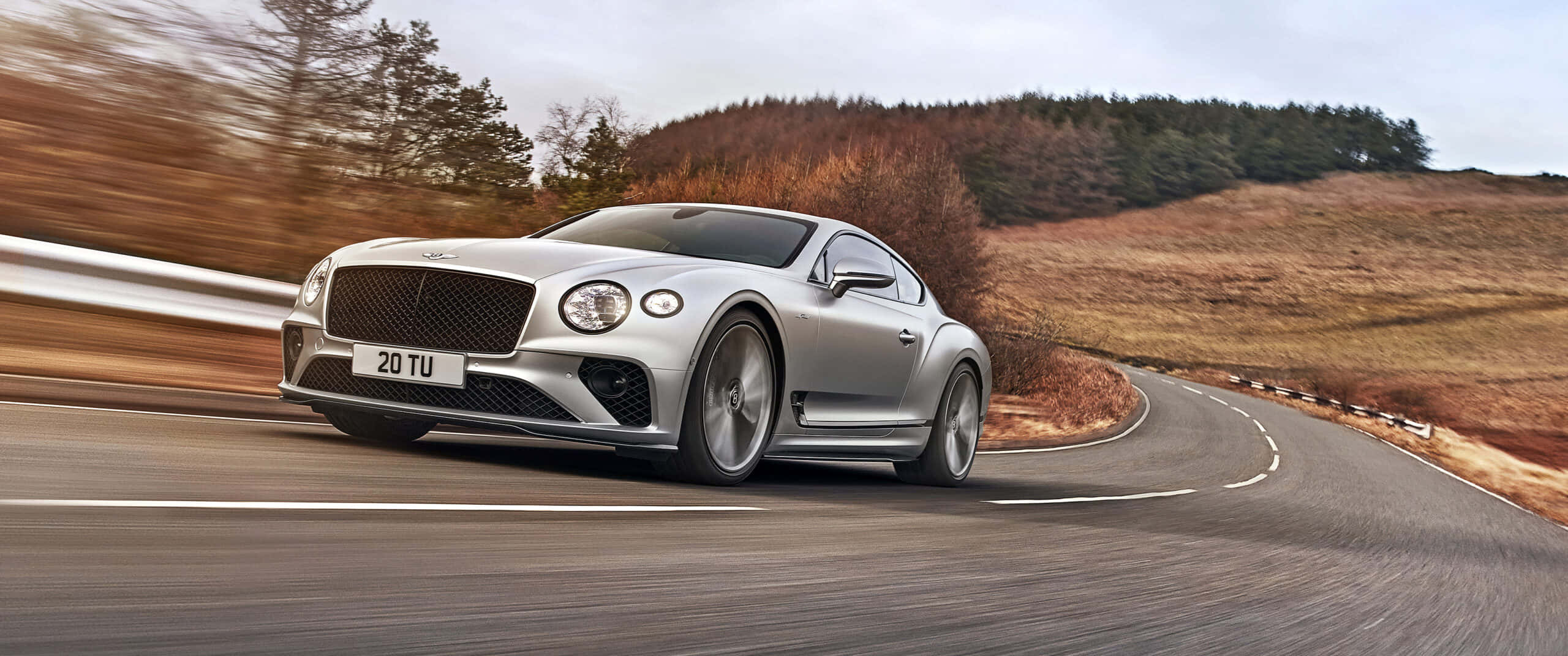 Bentley Continental GT, silver, winding rural road, 2K Desktop Wallpaper