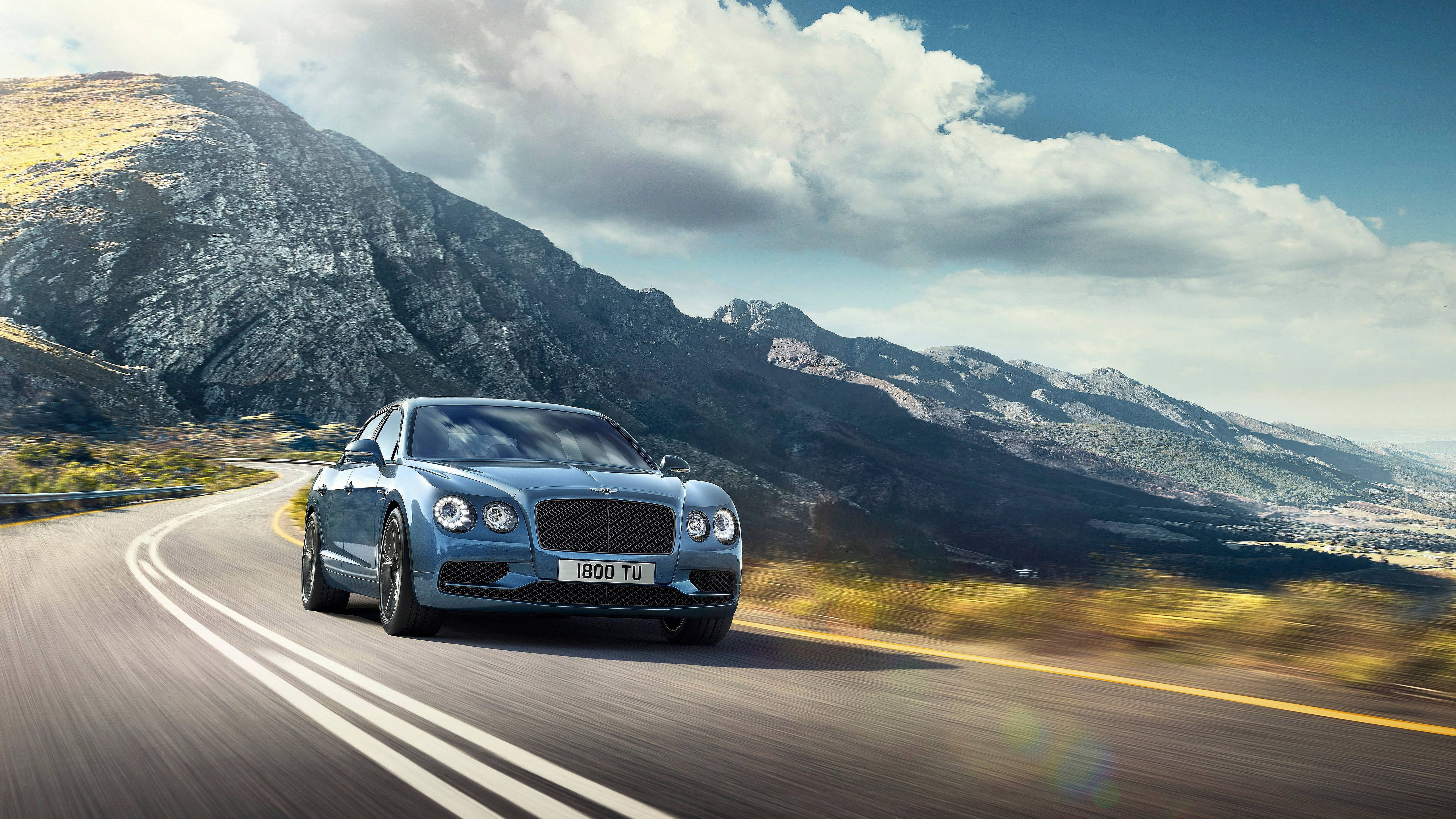 Bentley Flying Spur, sleek blue, winding mountain road, 5K Desktop Wallpaper