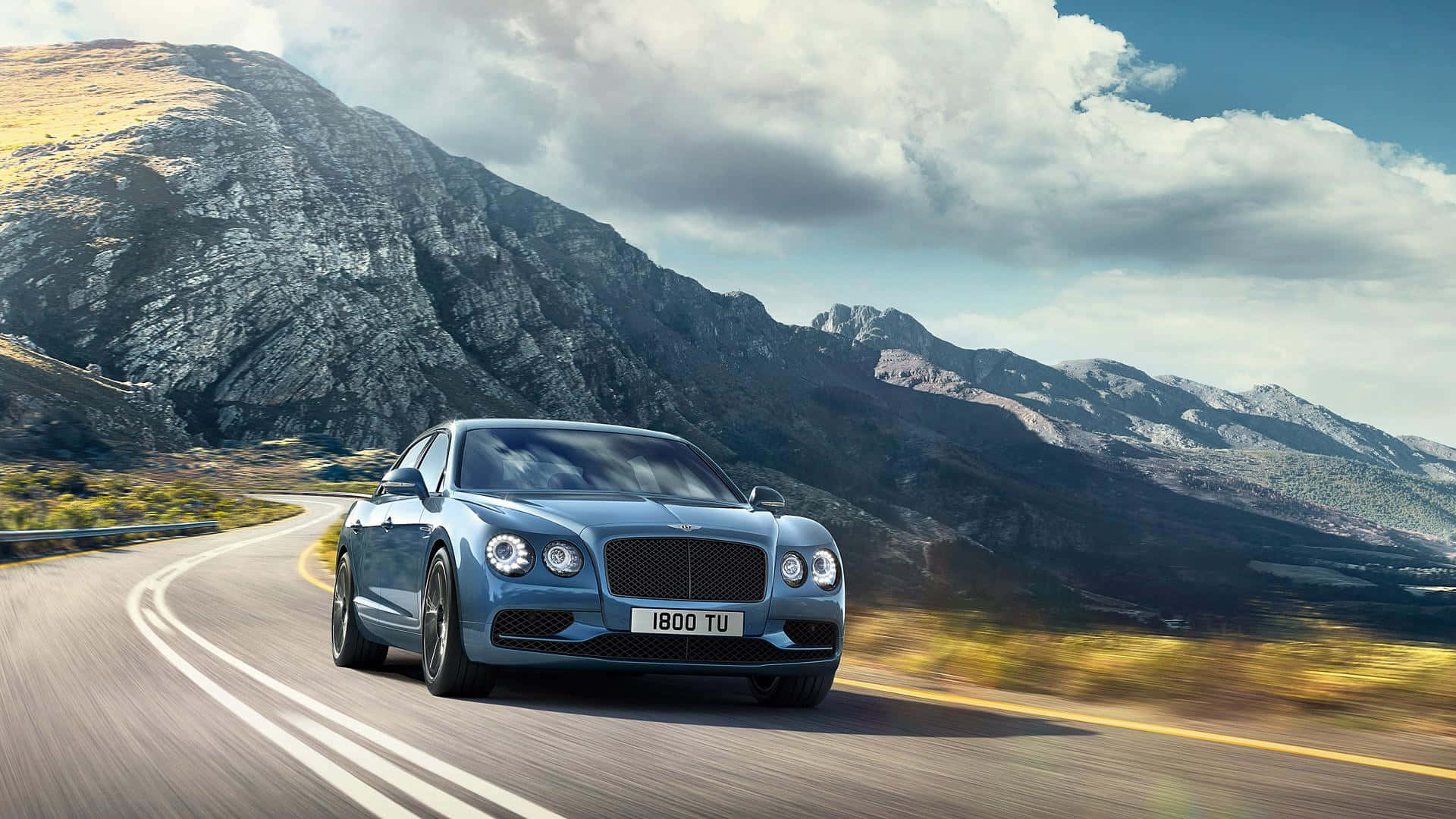 Bentley Flying Spur, sleek blue, winding mountain road, Full HD Desktop Wallpaper