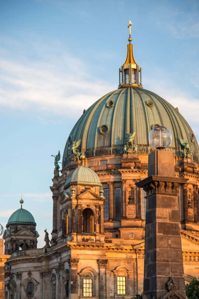 Berlin Cathedral, green copper roof, golden sunset light, SD Phone Wallpaper