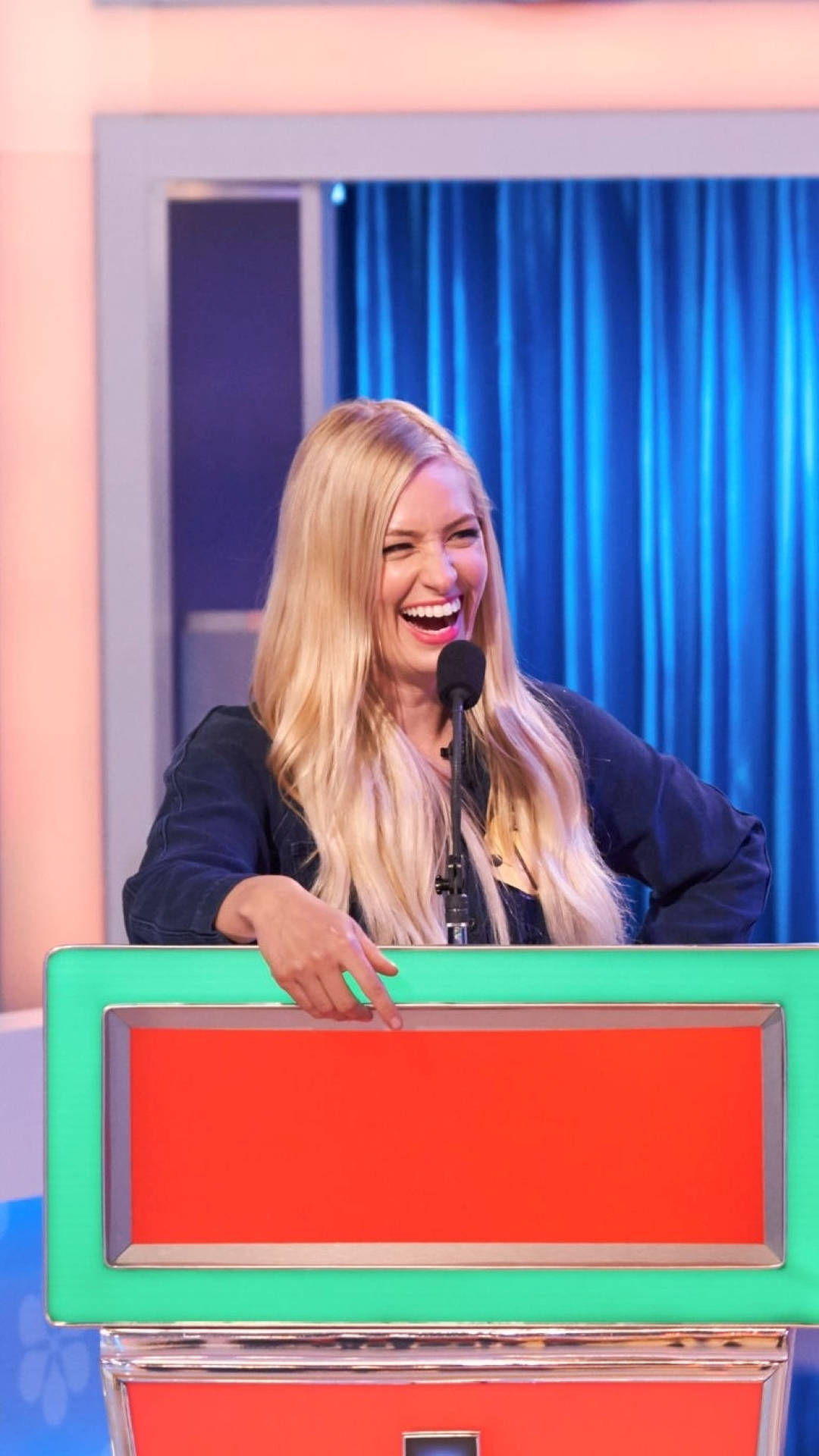 Beth Behrs, blonde woman, bright green and orange game show podium, Full HD Phone Wallpaper