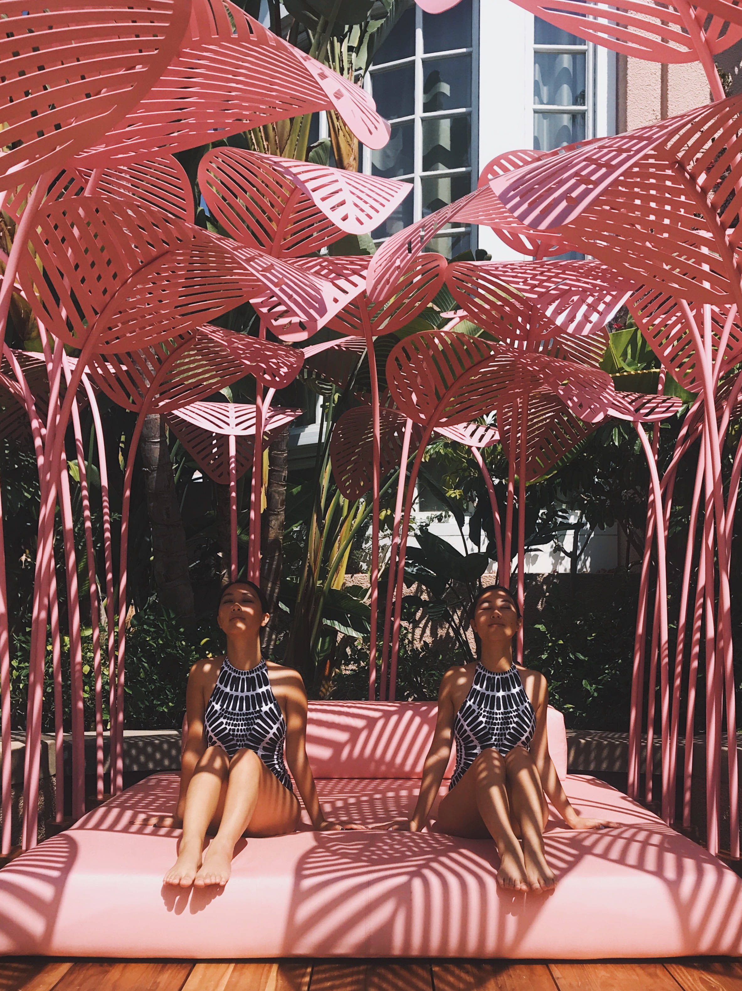 Beverly Hills Hotel, pink lounge, oversized pink metal palm sculptures, 2K Phone Wallpaper