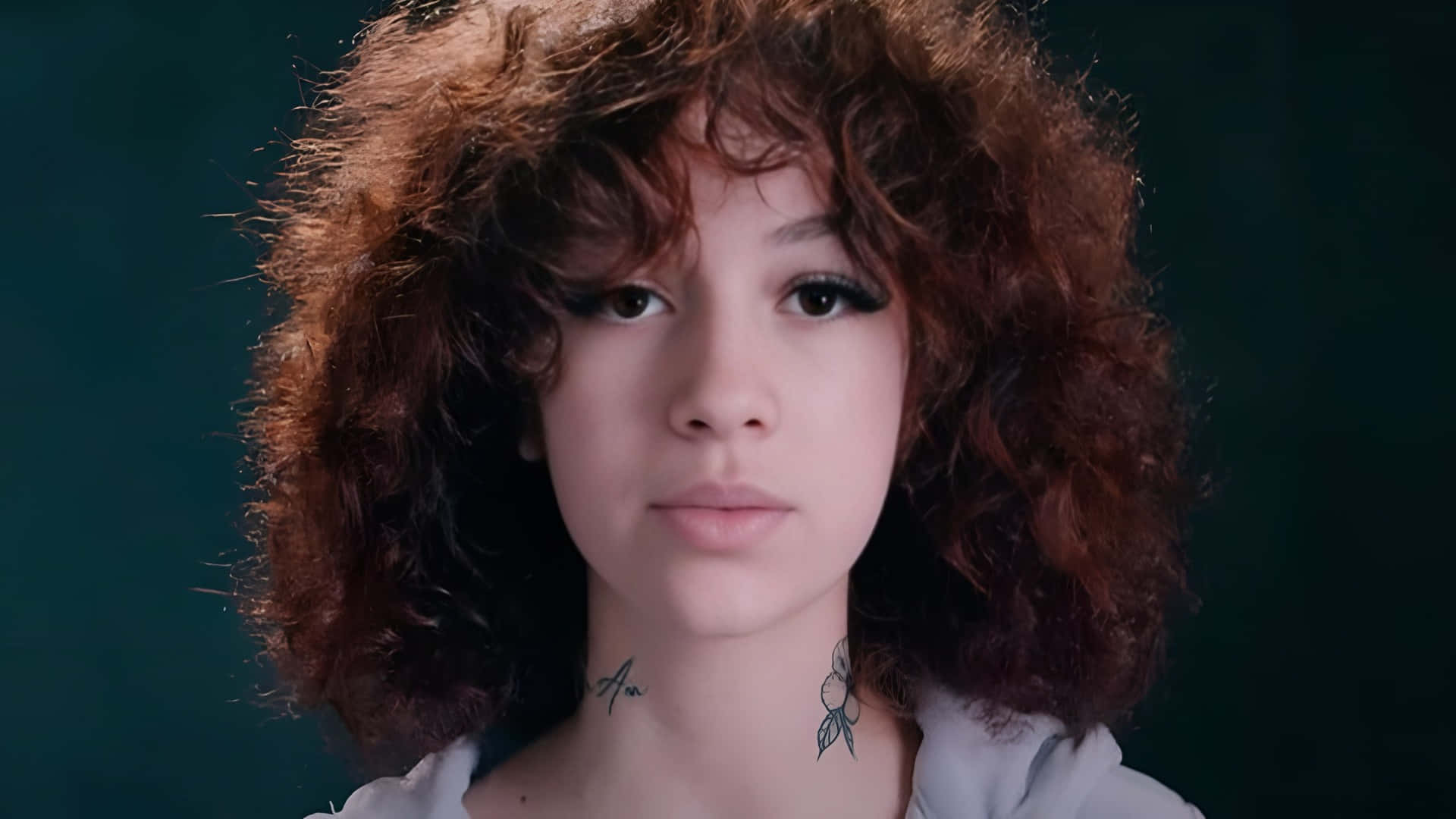 Bhad Bhabie, voluminous curly auburn hair, dark teal backdrop, Full HD Desktop Wallpaper