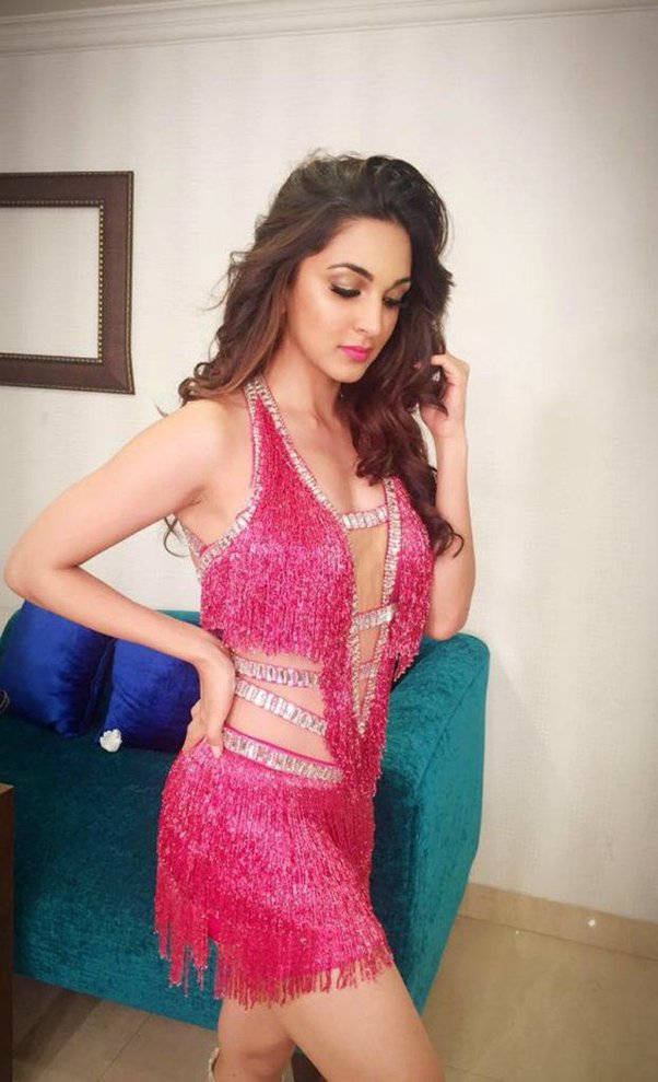 Bhojpuri actress, pink fringe outfit, teal sofa, SD Phone Wallpaper