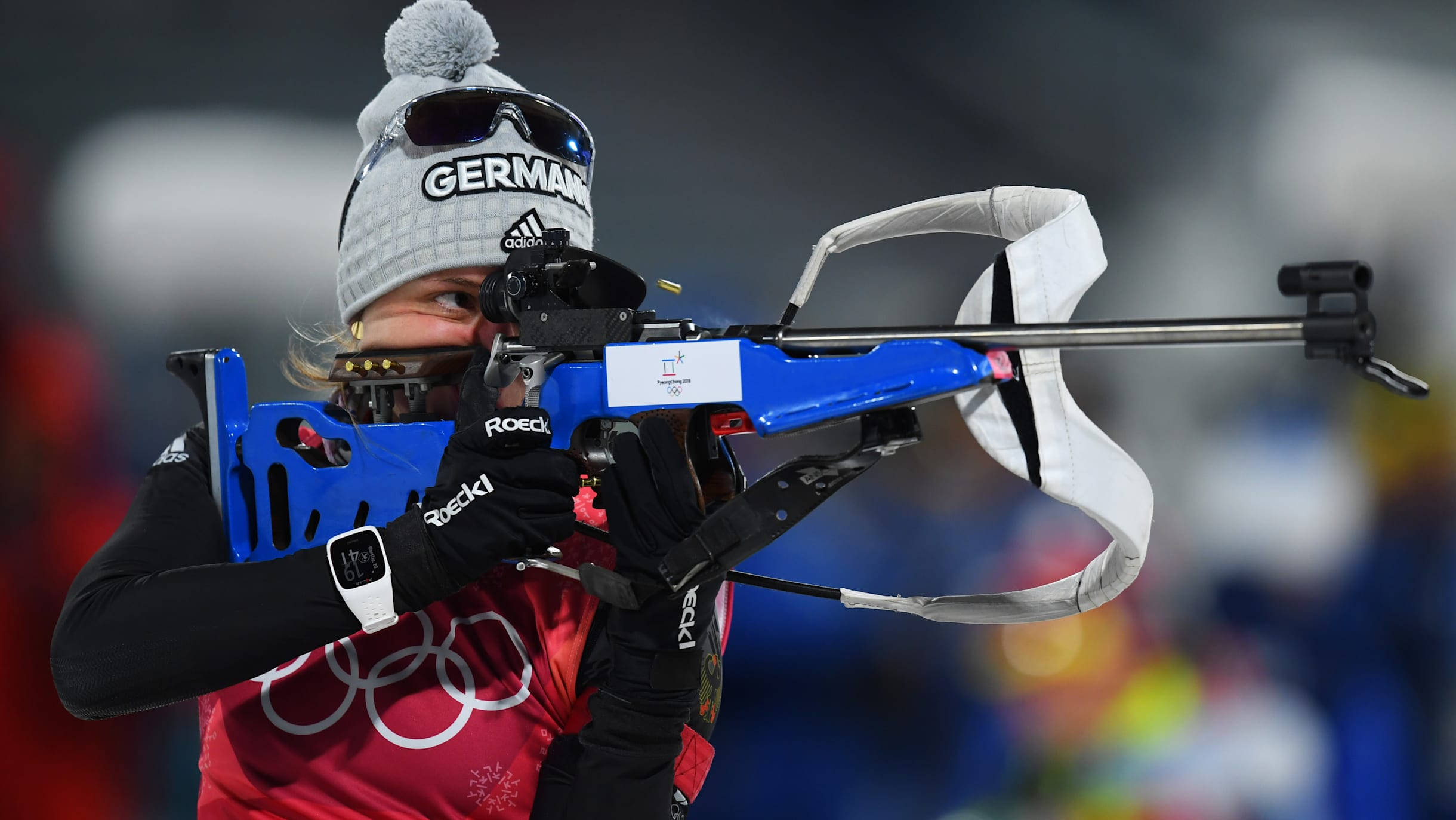 German biathlete, red Olympic gear, blue rifle, Full HD Desktop Wallpaper