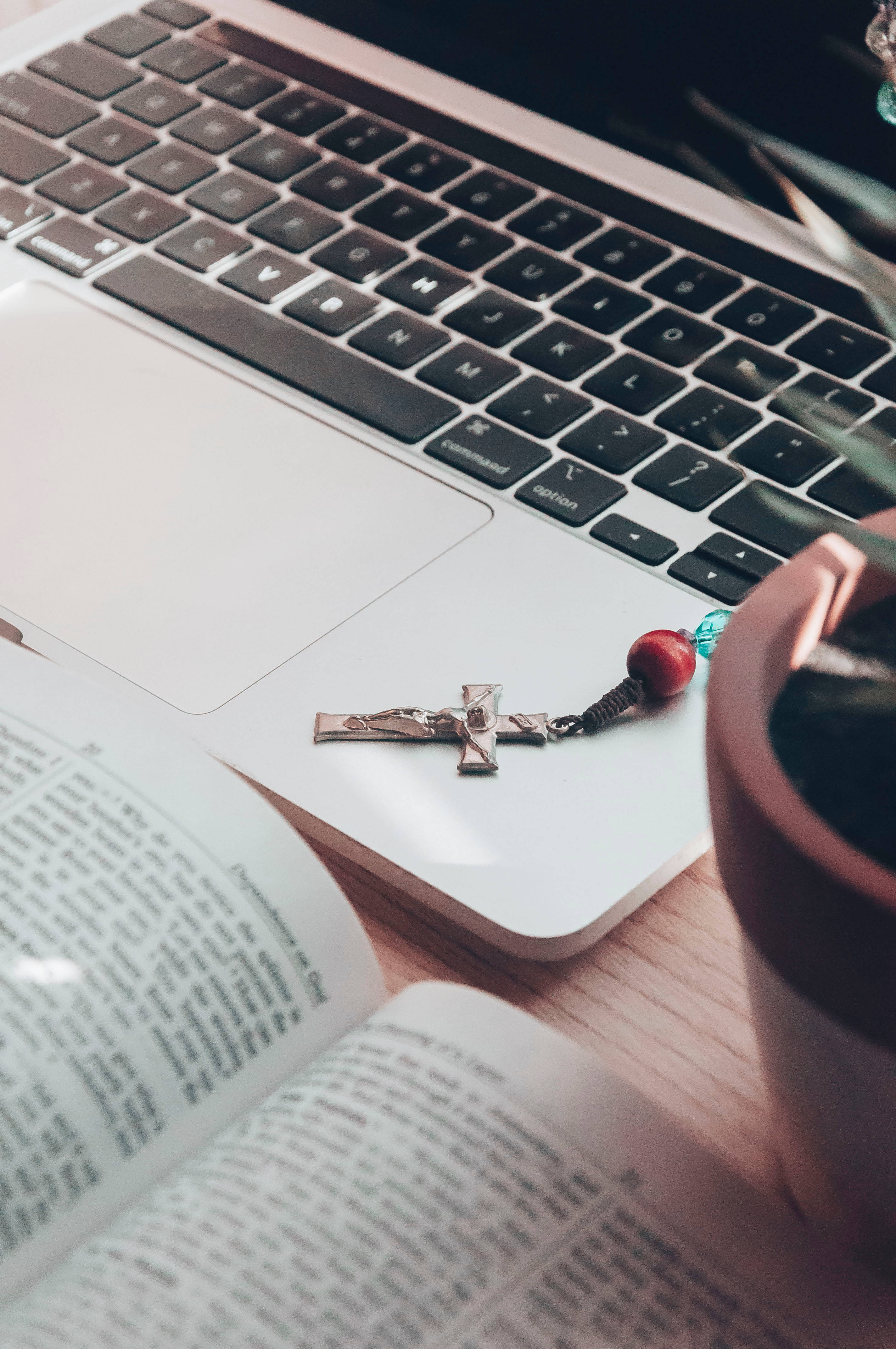 silver crucifix, laptop keyboard, open book, 4K Phone Wallpaper