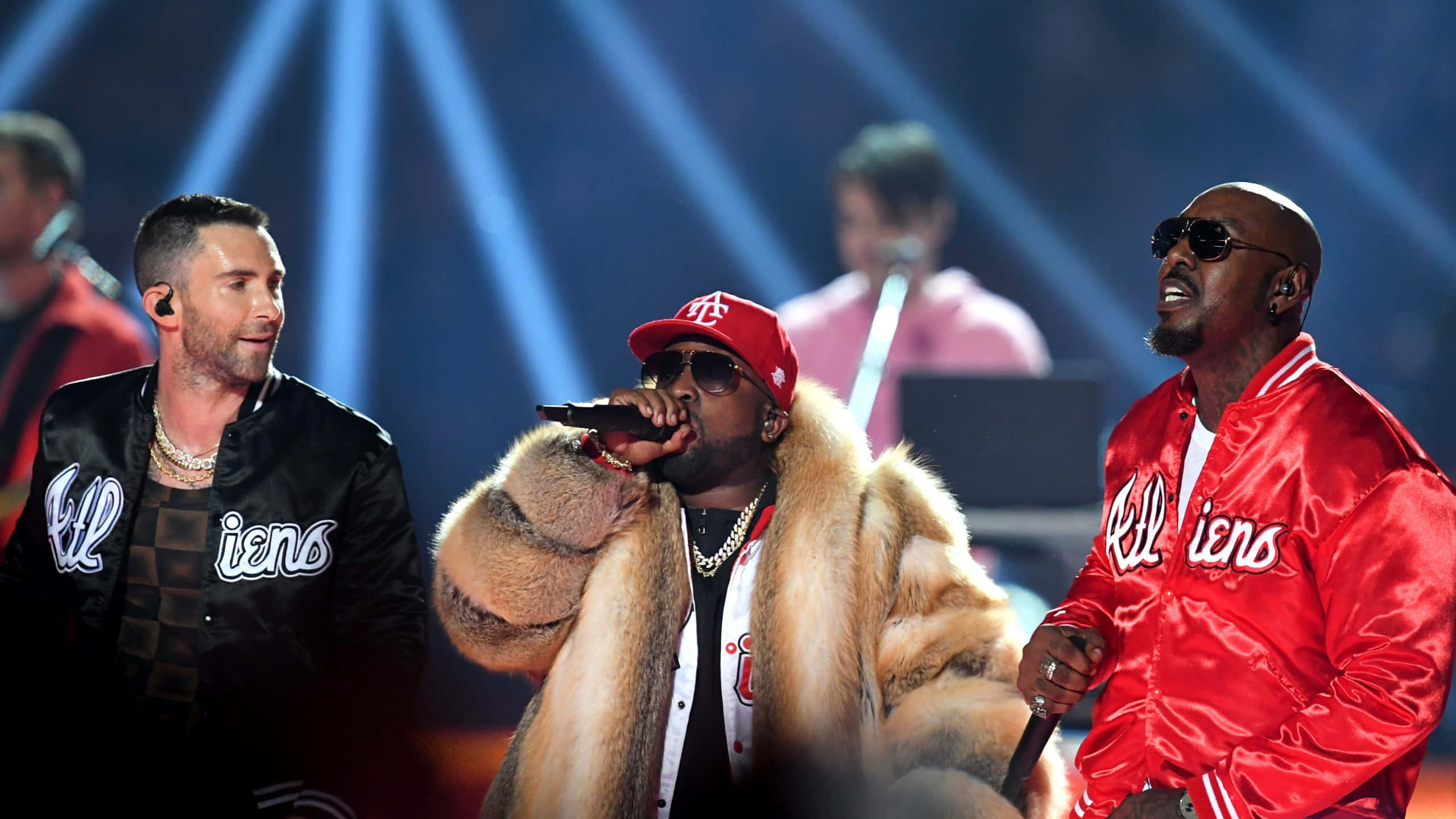 Big Boi, red and black jackets with fur accents, bright blue spotlights, 2K Desktop Wallpaper