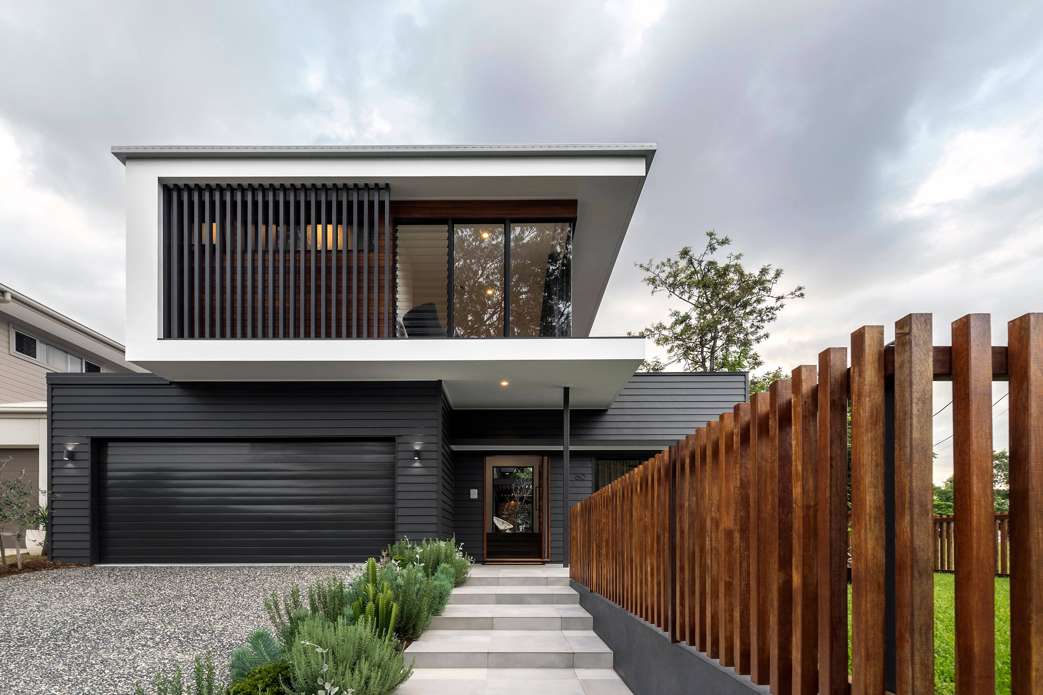 Modern Big House, wooden fence, black siding, 2K Desktop Wallpaper
