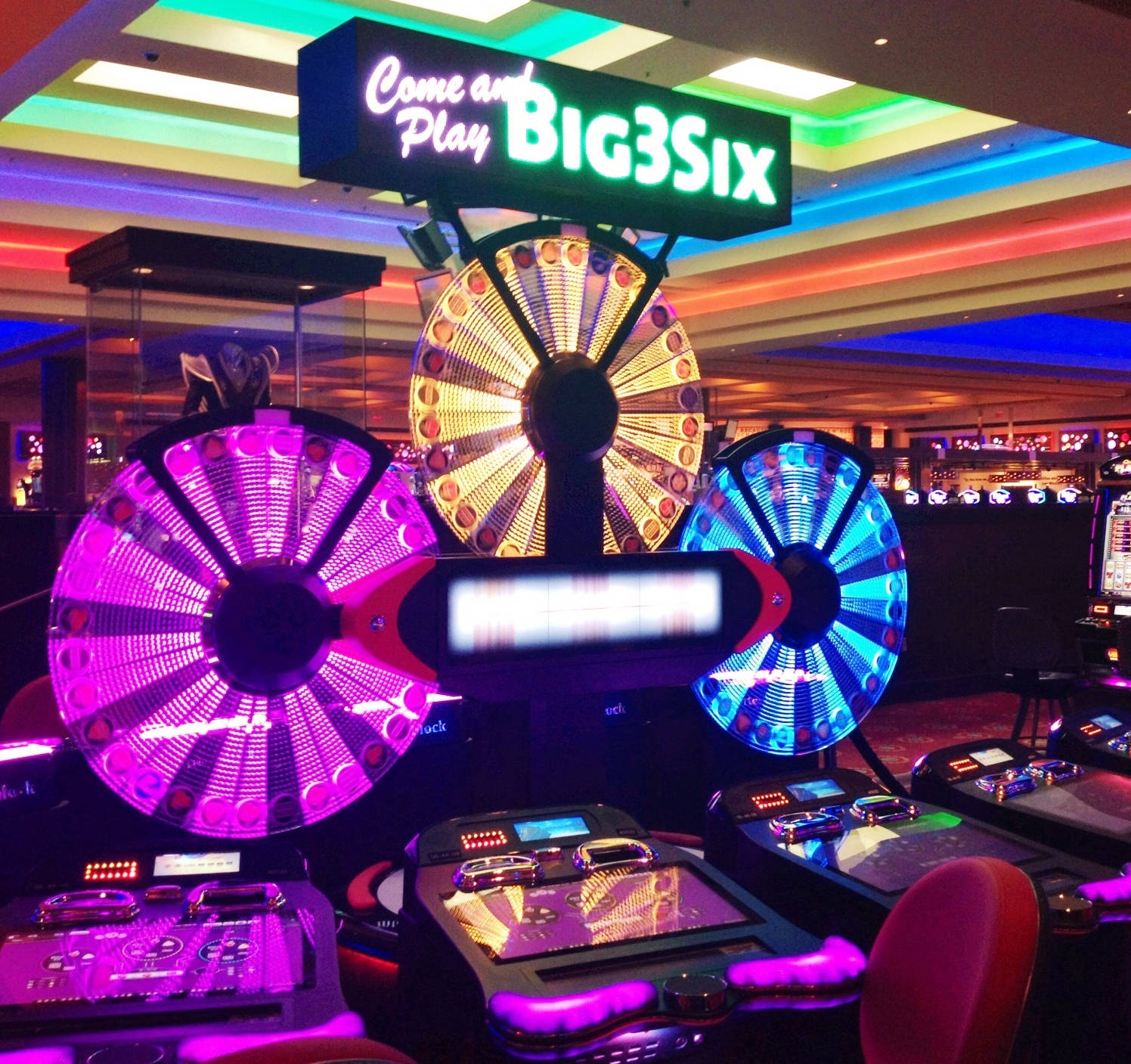 Big Six Wheel, neon-lit casino gaming machines, spinning reels, HD Desktop Wallpaper