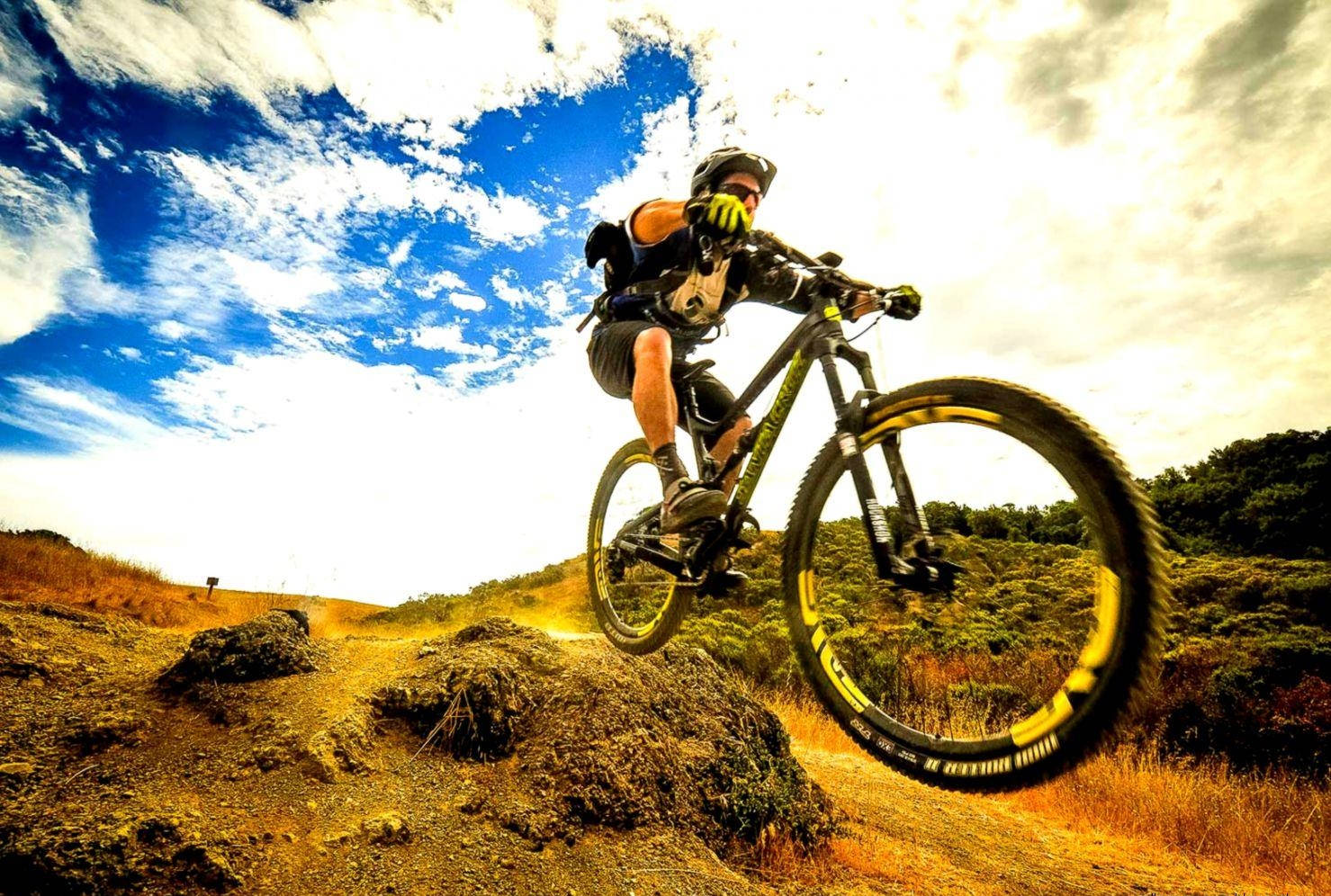 mountain biker, rocky trail, dramatic blue sky, HD Desktop Wallpaper