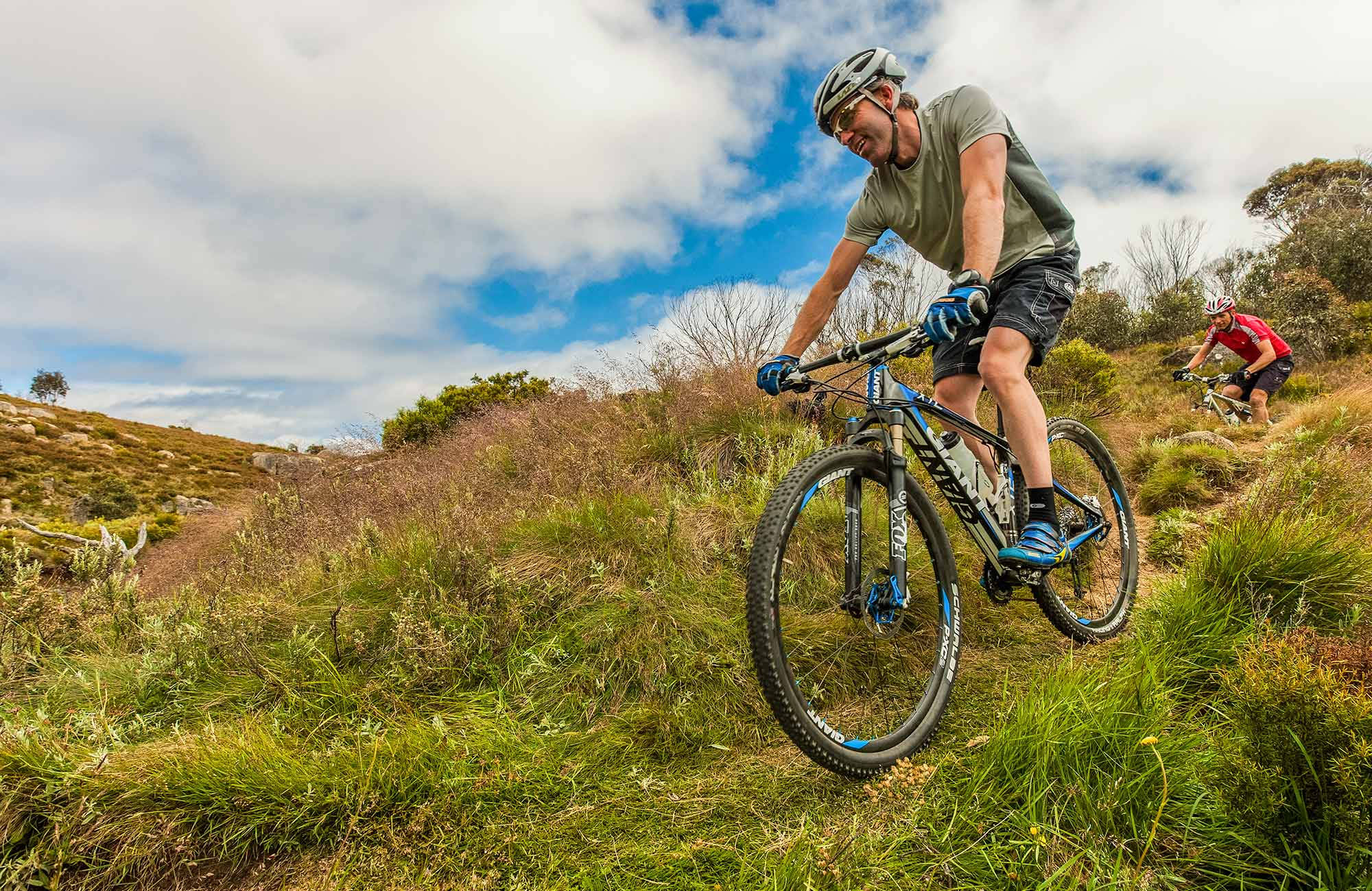 mountain biker, grassy trail, partly cloudy sky, Full HD Desktop Wallpaper